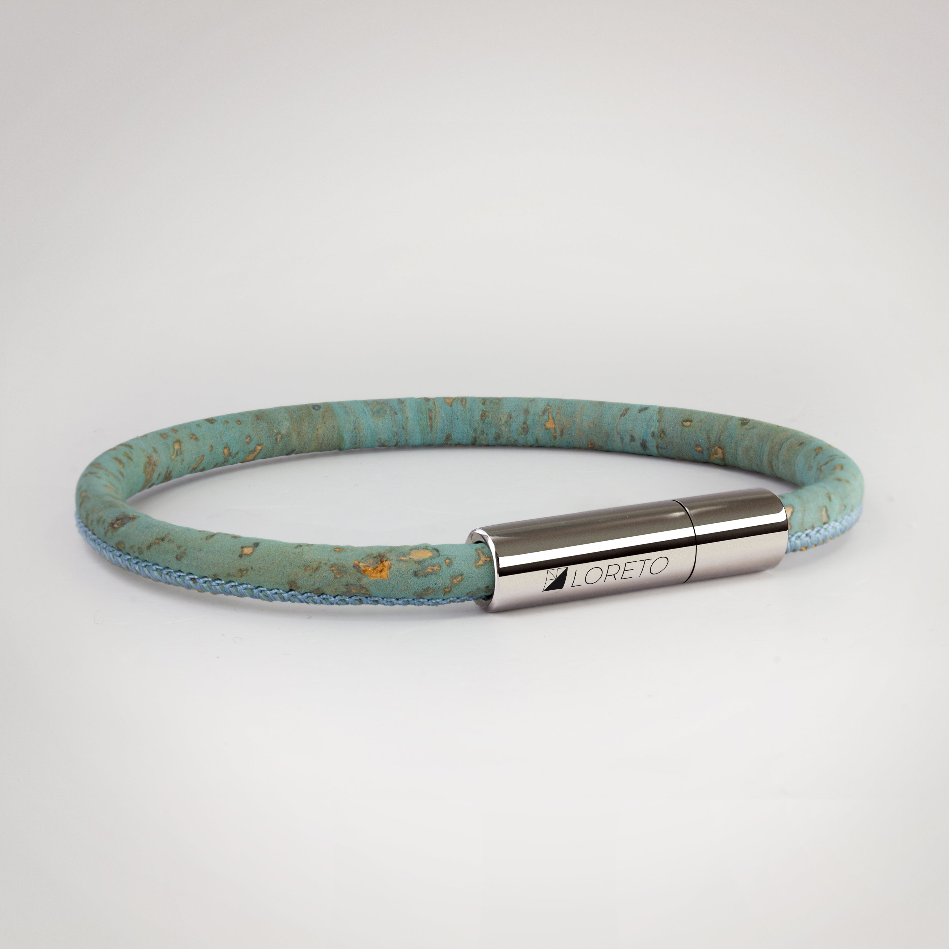 Simple blue bracelet made from natural cork fiber and titanium.