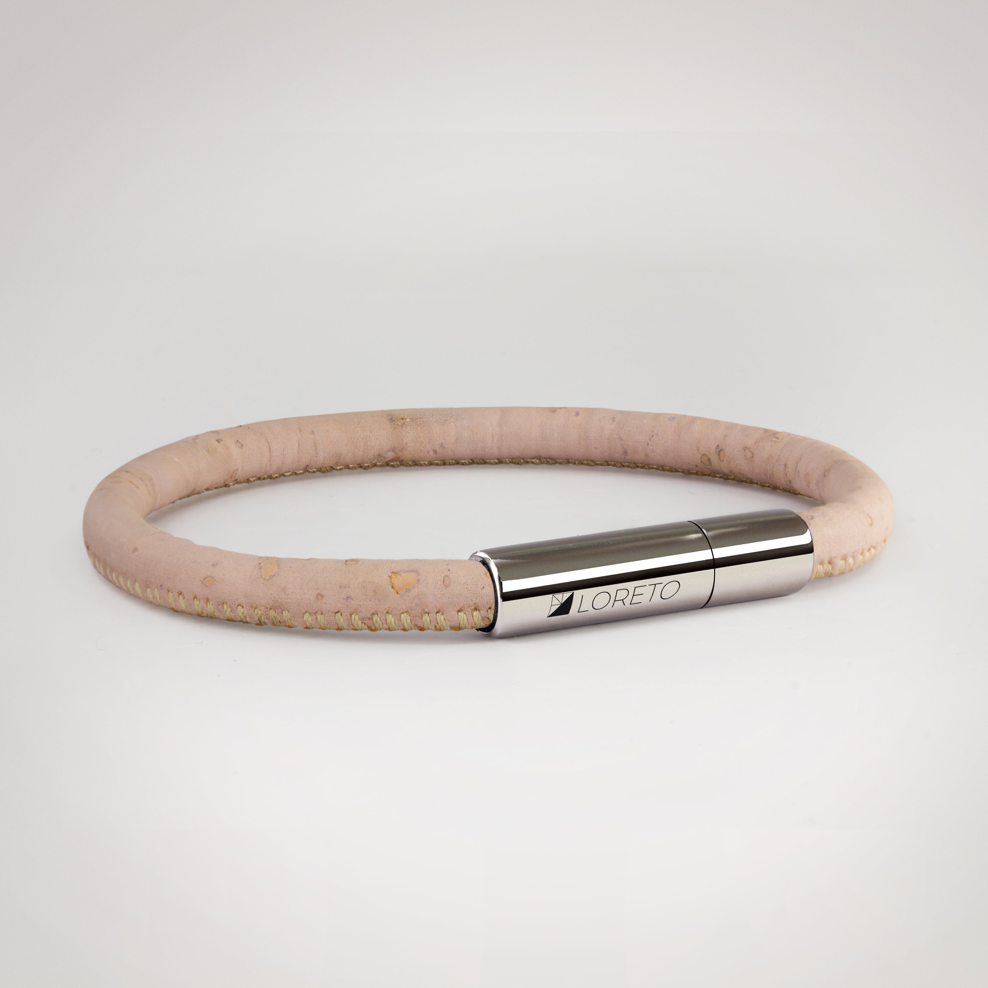 Simple pink bracelet made from natural cork fiber and titanium.