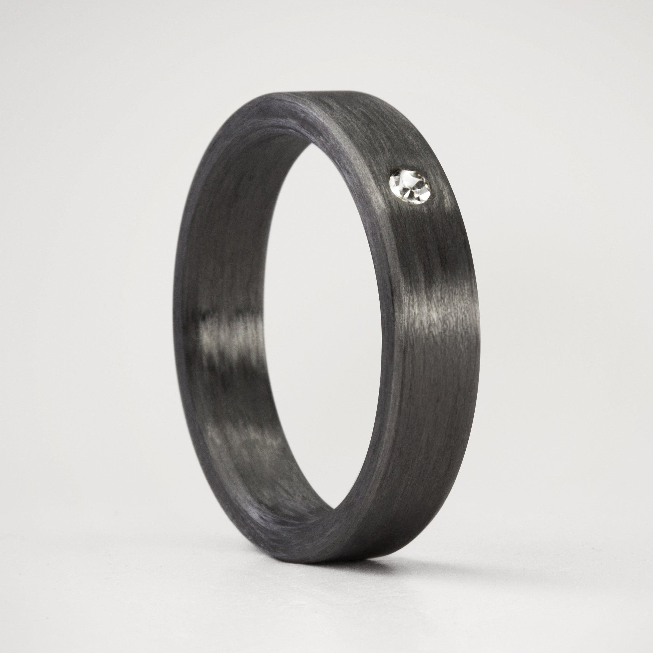 FLAT CARBON FIBER RING WITH WHITE CRYSTAL