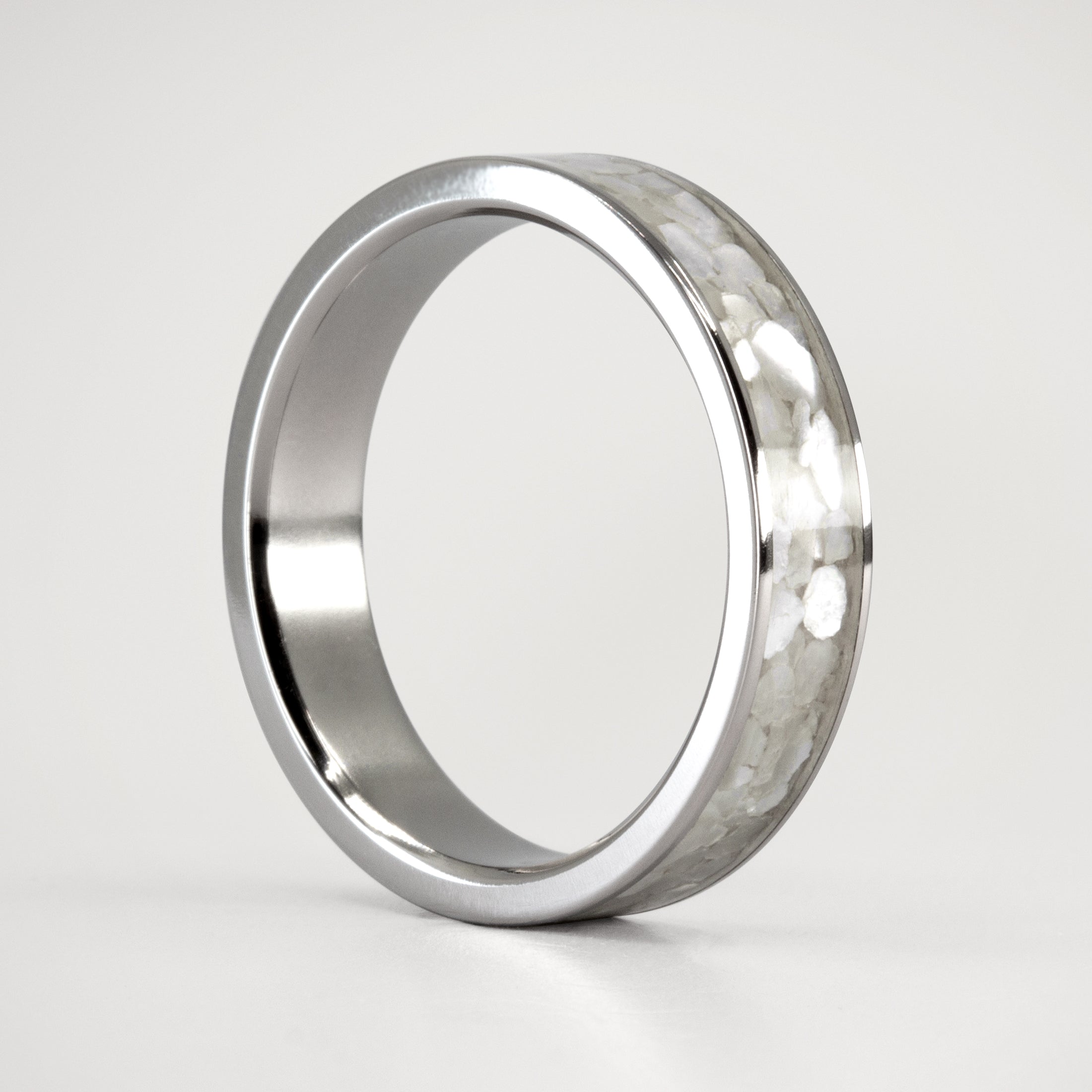 Nacre and titanium ring