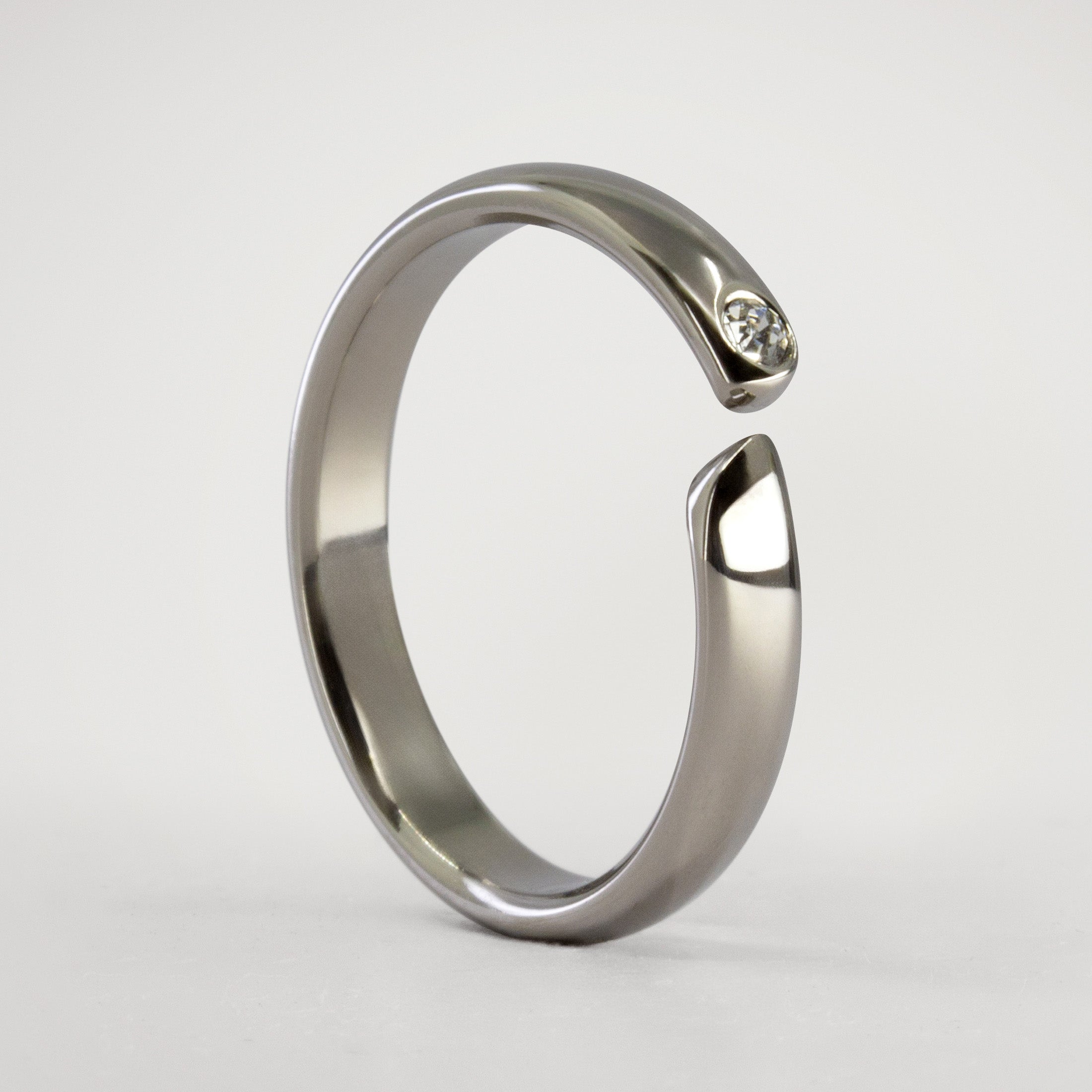 Split titanium dome ring with white crystal
