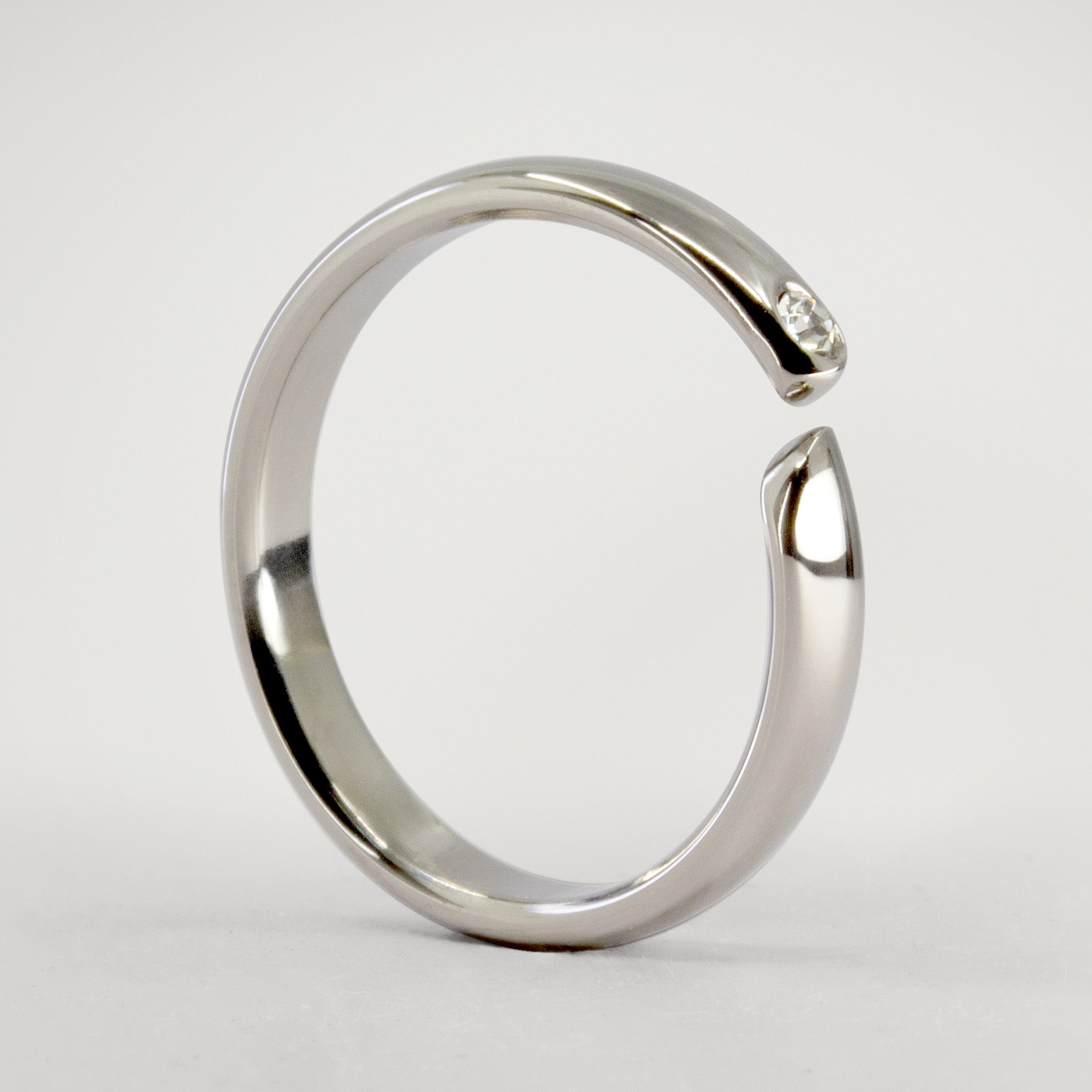 Split titanium dome ring with white crystal