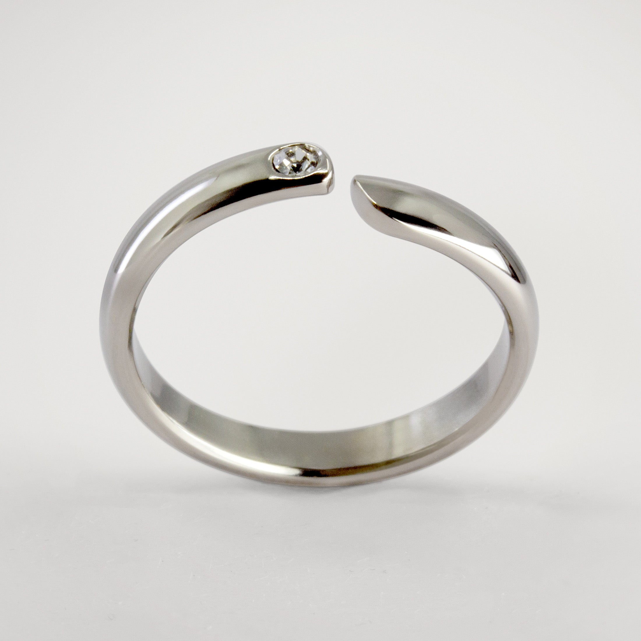 Split titanium dome ring with white crystal