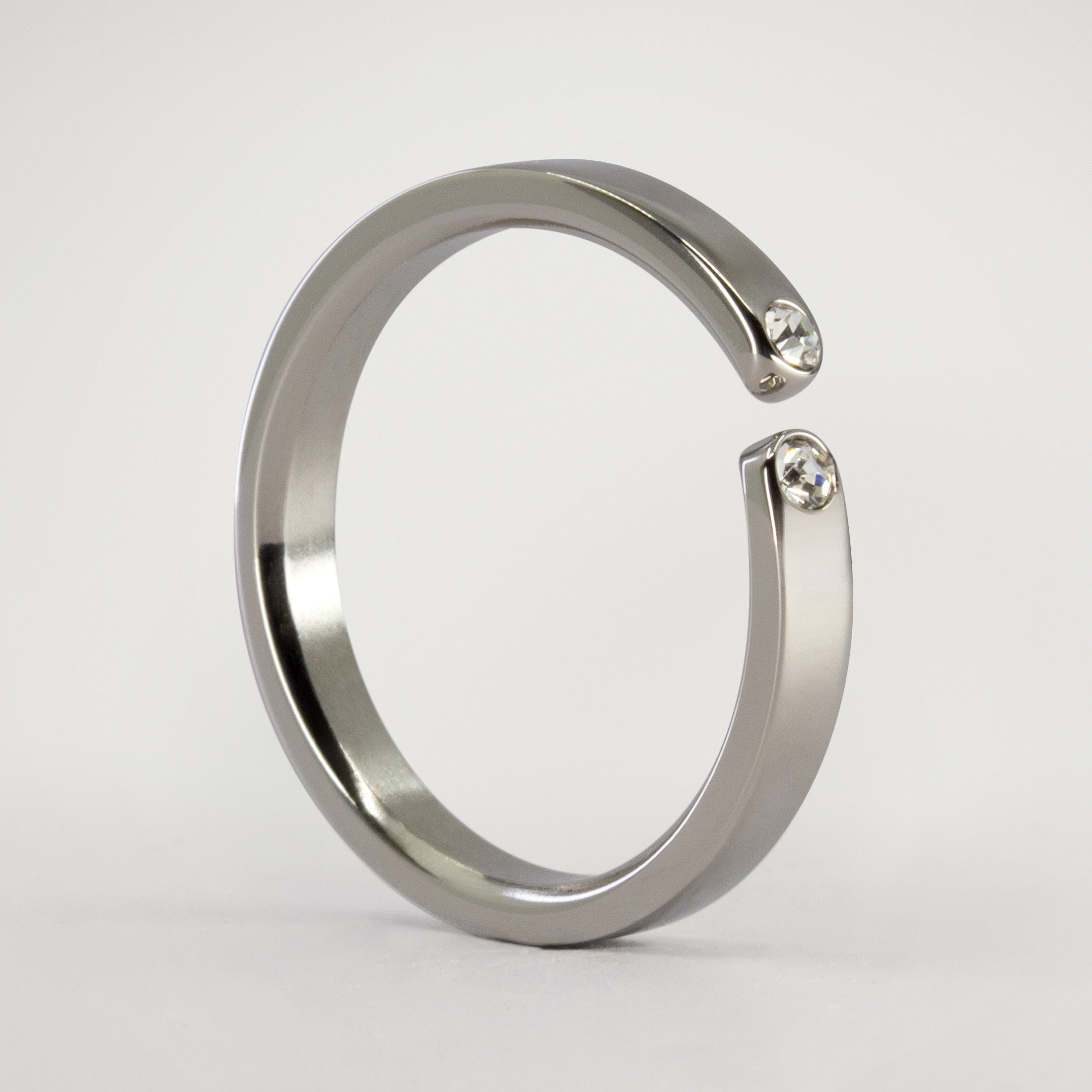 Split titanium ring with 2 white crystals