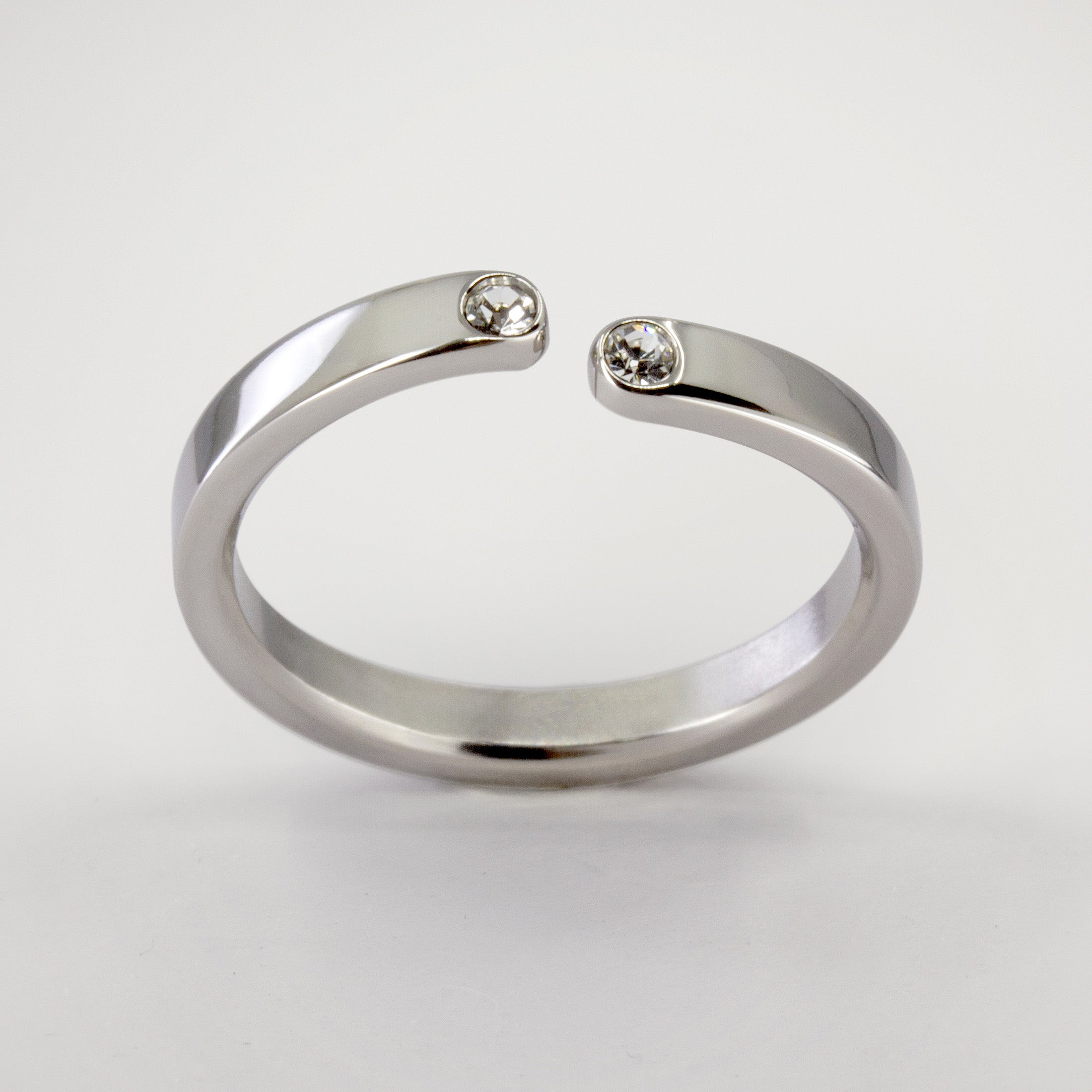 Split titanium ring with 2 white crystals