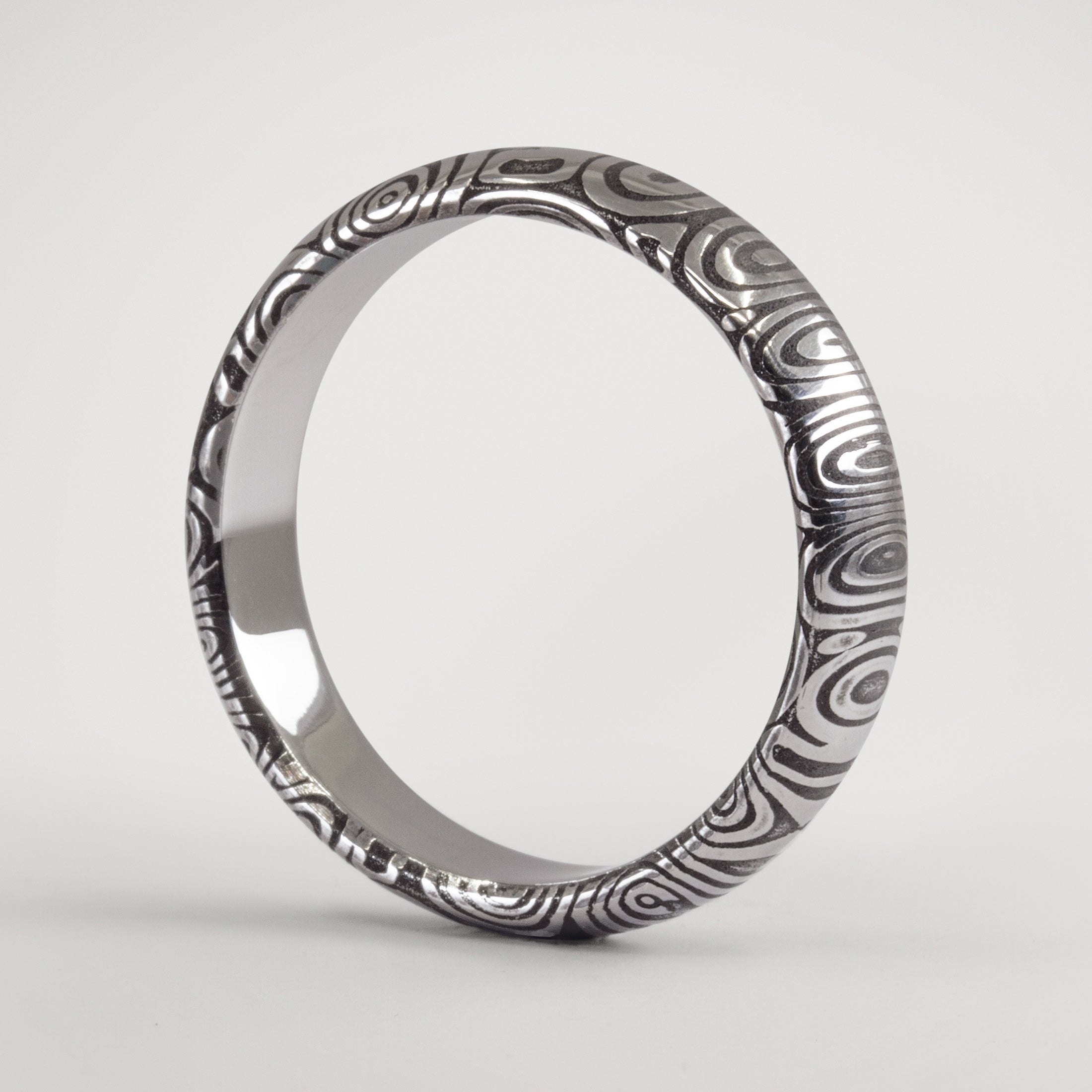 Darkened Damascus steel men Ring
