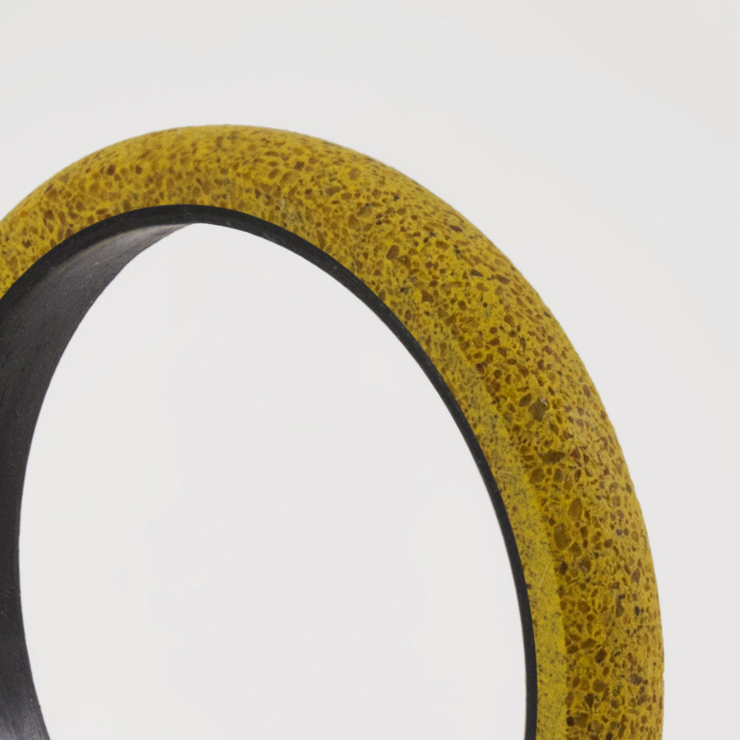 yellow concrete and carbon fiber ring