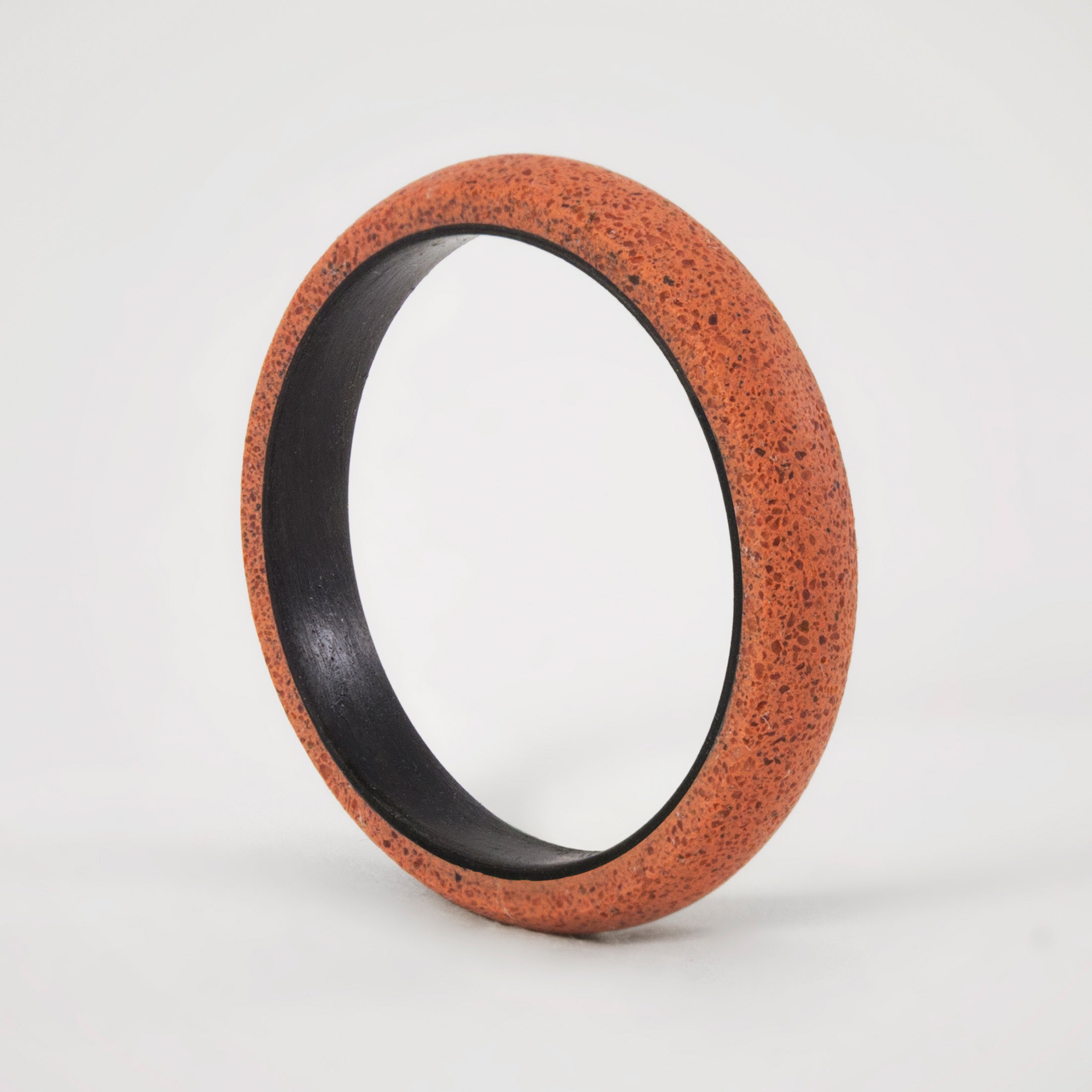 pink concrete and carbon fiber ring