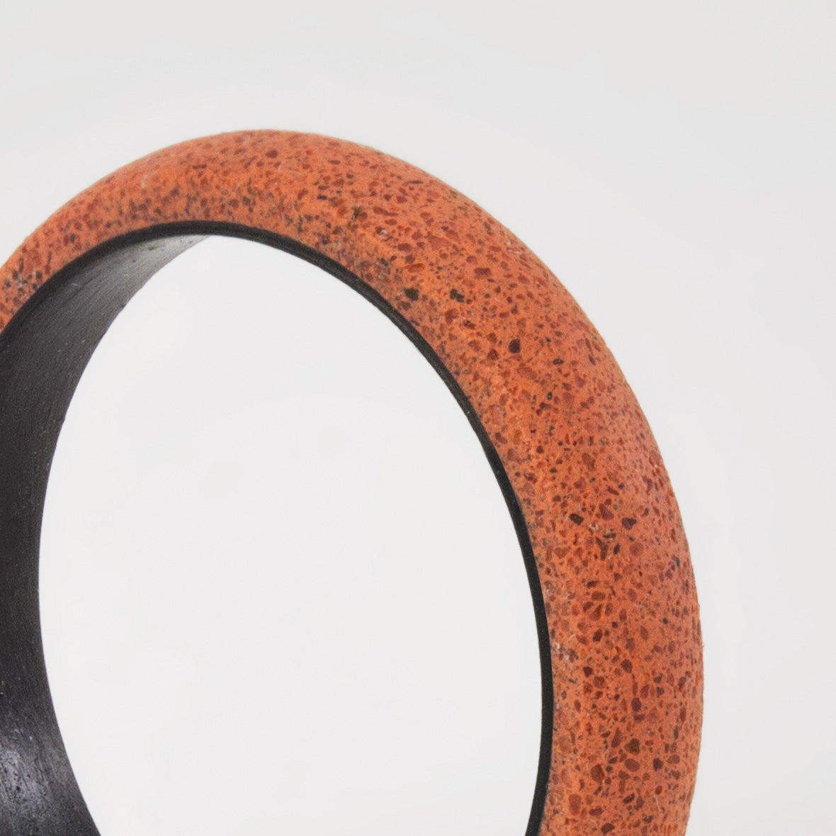 pink concrete and carbon fiber ring