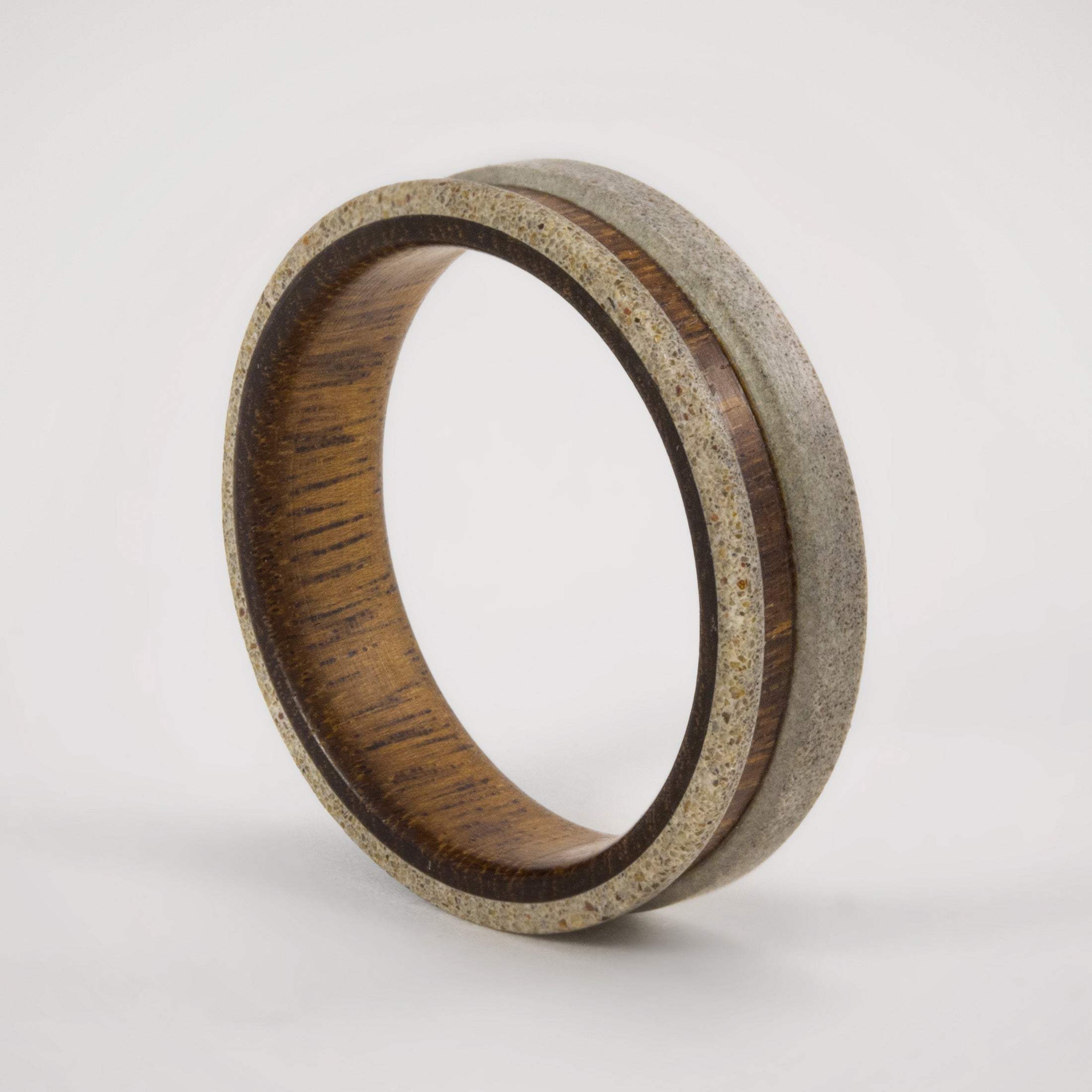 light gray concrete and wood ring