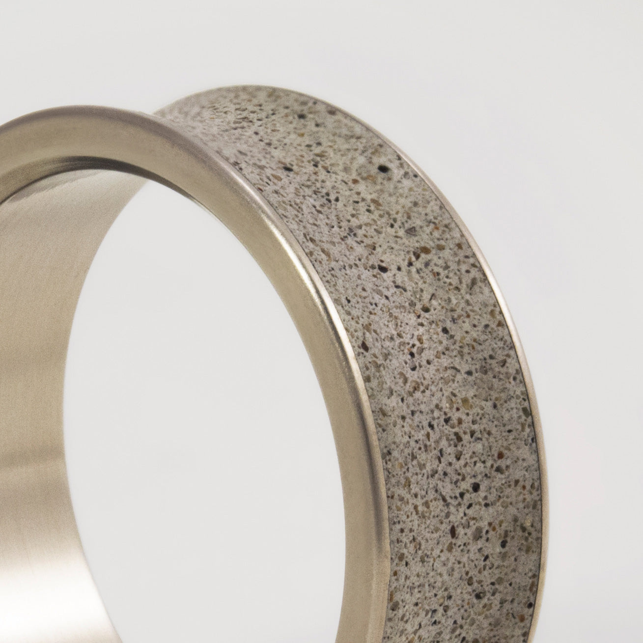 Gray concrete & titanium ring