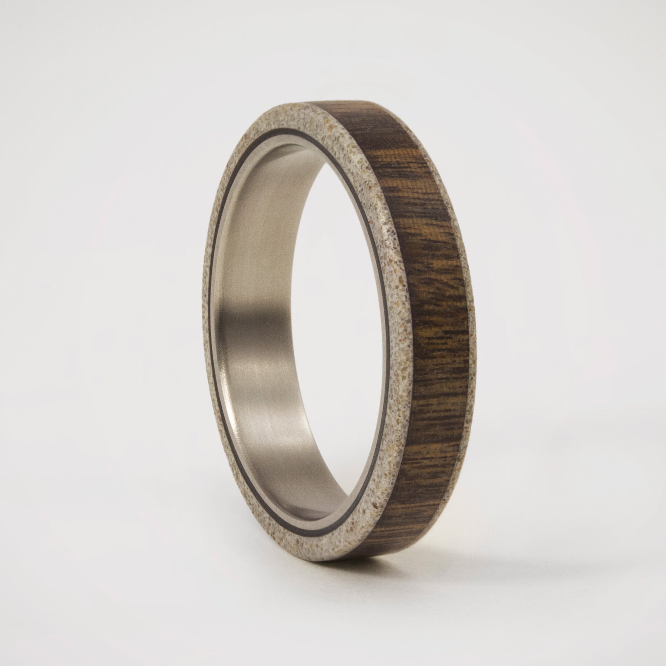 wood, gray concrete and titanium women ring