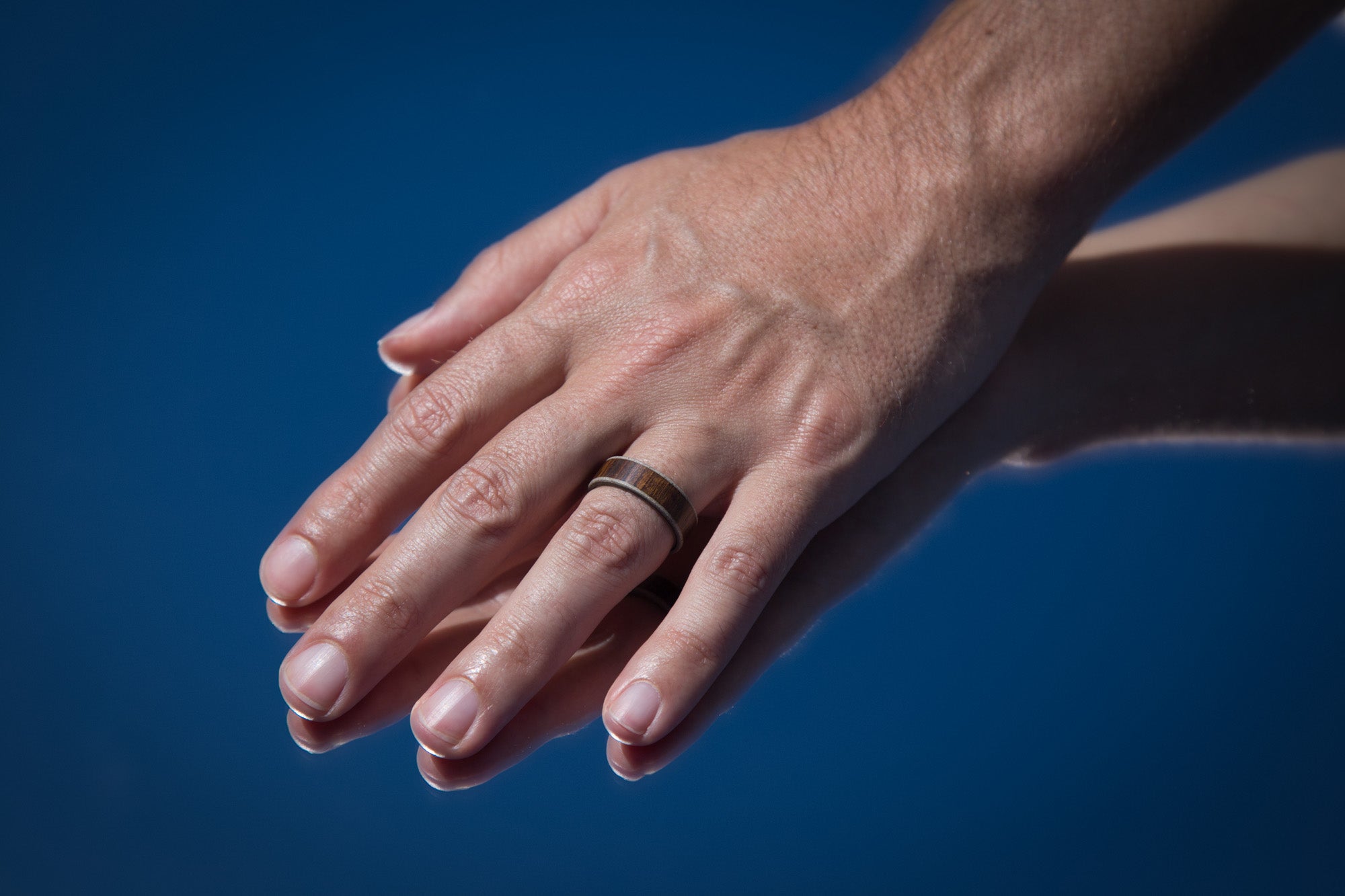 wood, gray concrete and titanium men ring