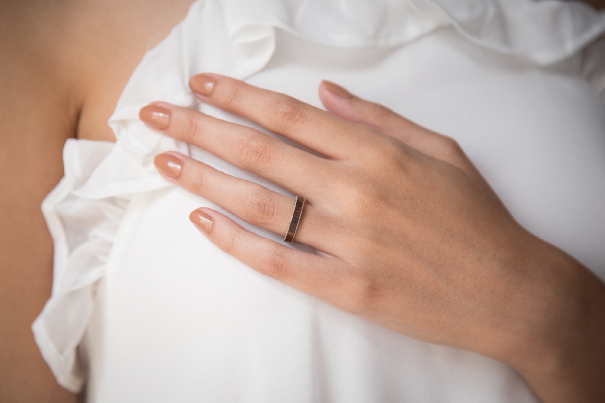 wood, gray concrete and titanium women ring