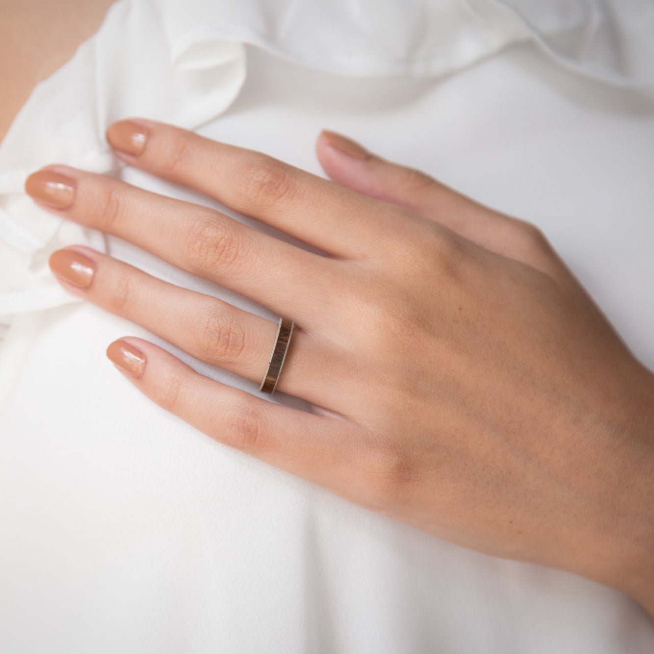 wood, gray concrete and titanium women ring