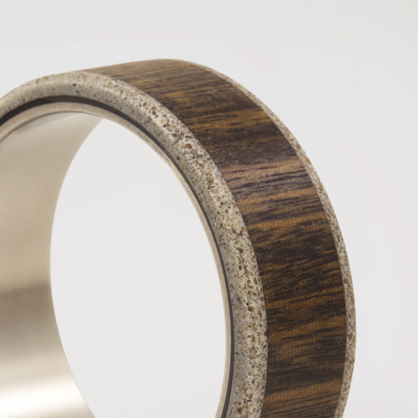 wood, gray concrete and titanium men ring