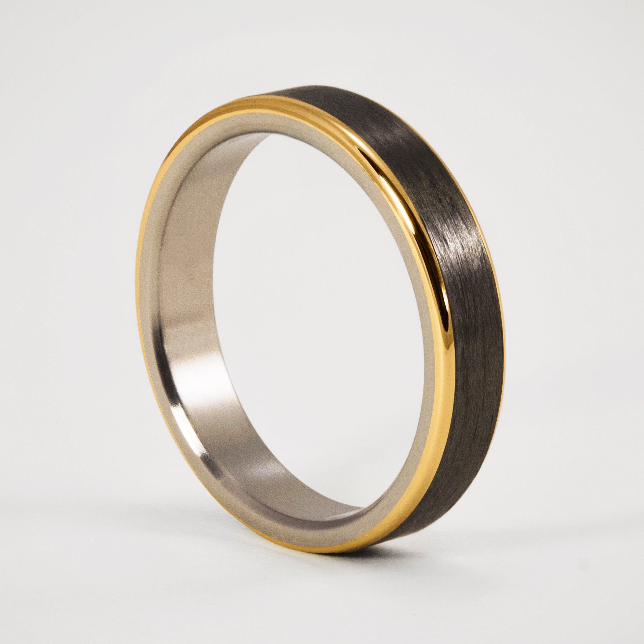 18K Gold, carbon fiber and titanium Ring
