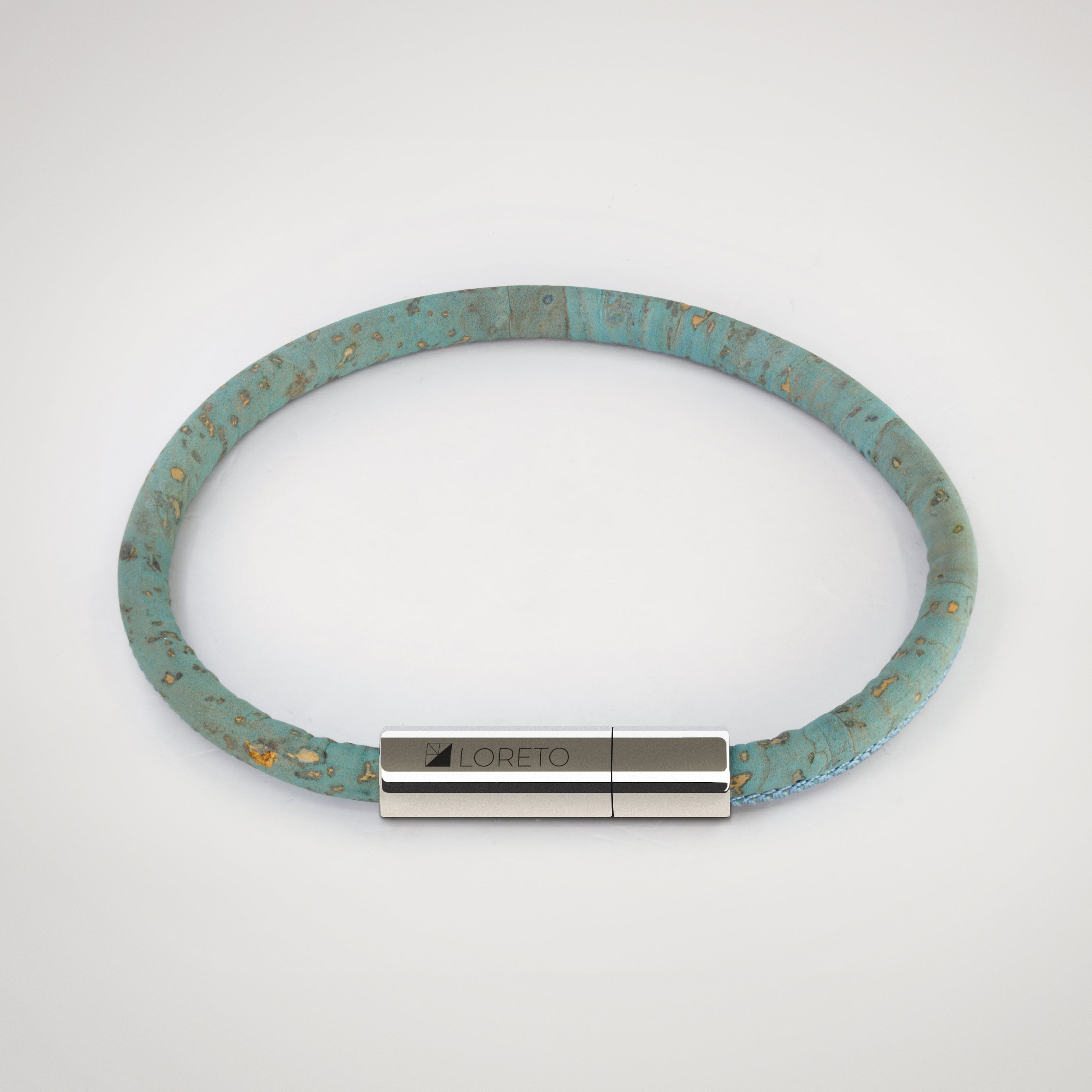 Simple blue bracelet made from natural cork fiber and titanium.