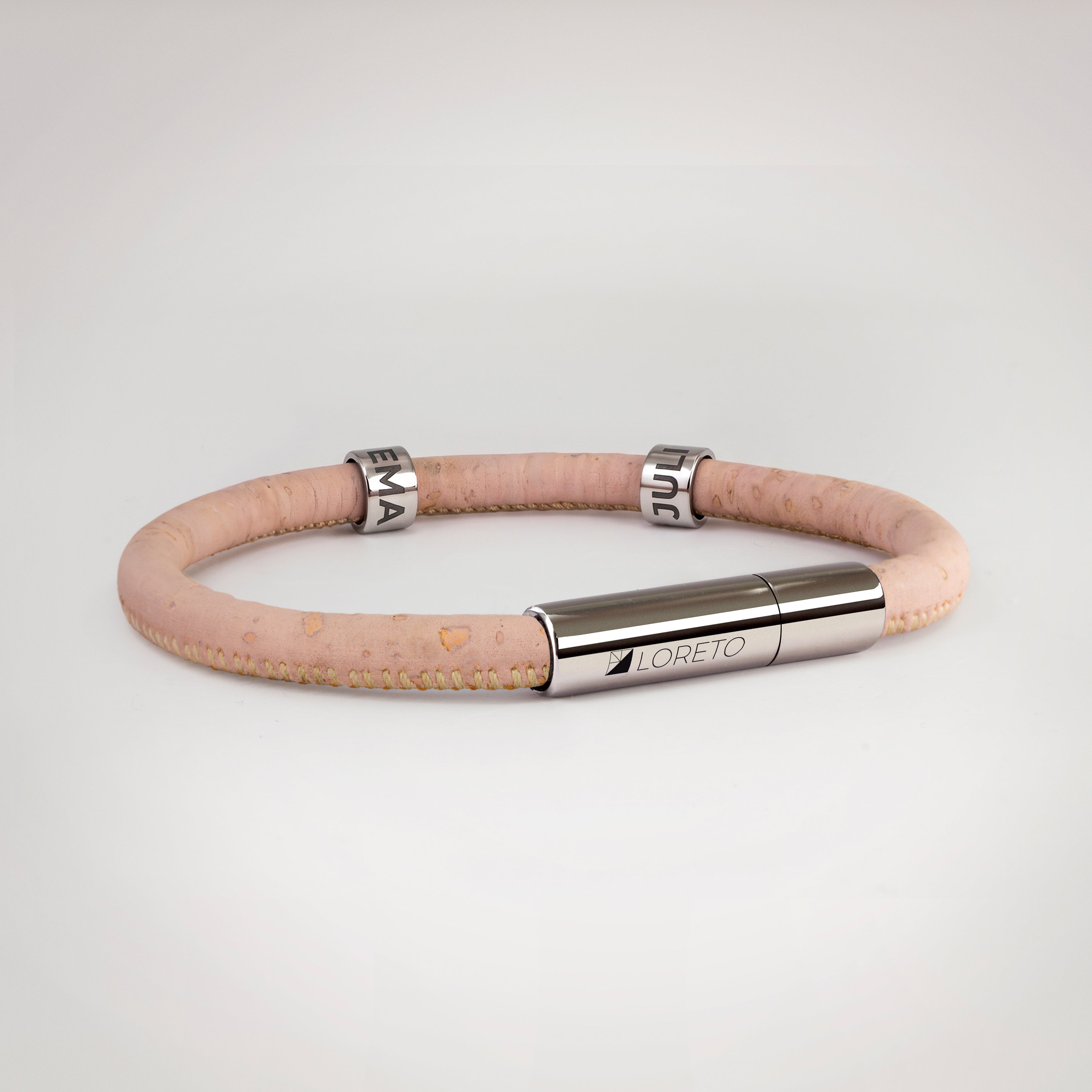 Simple pink bracelet made from natural cork fiber and titanium.