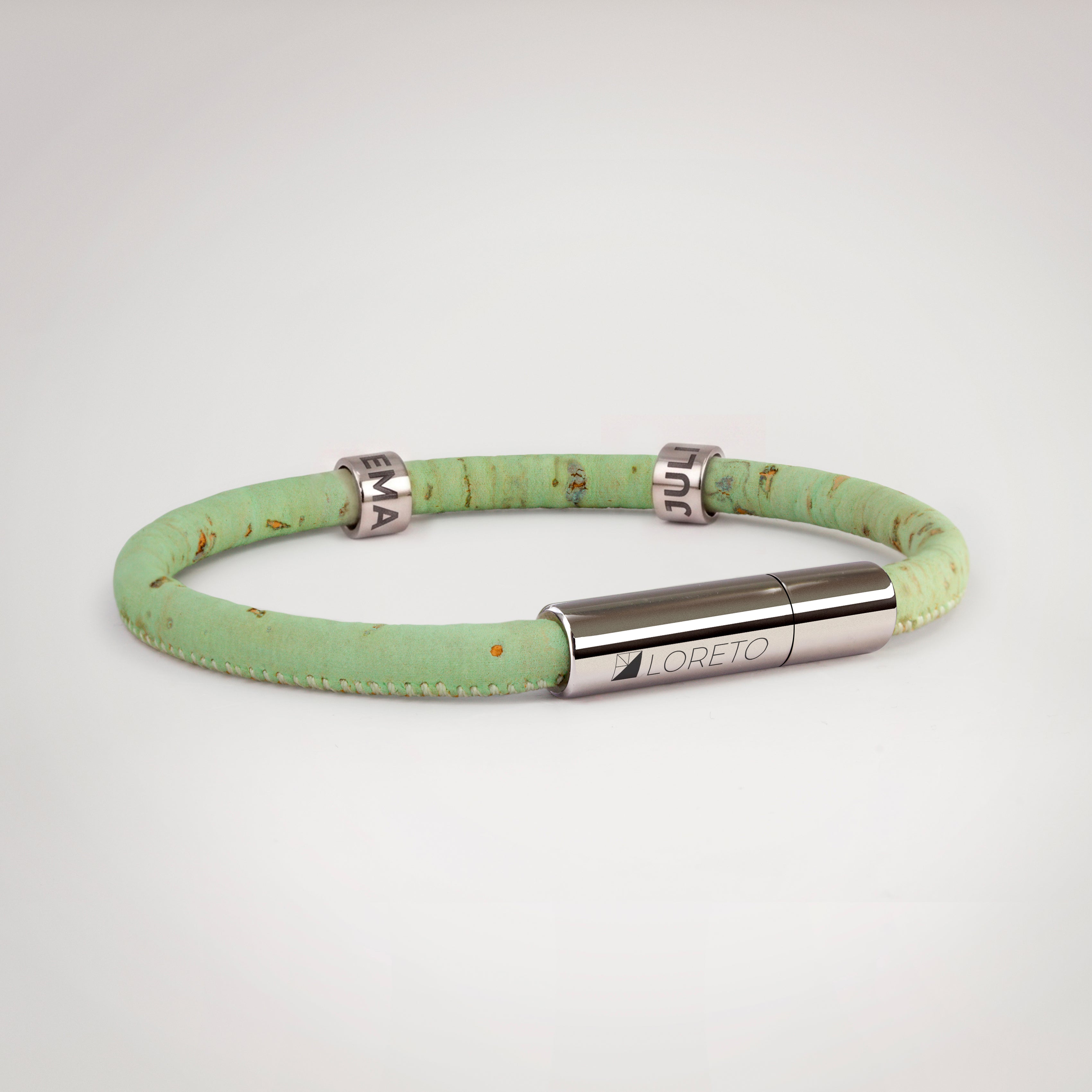 Simple green bracelet made from natural cork fiber and titanium.