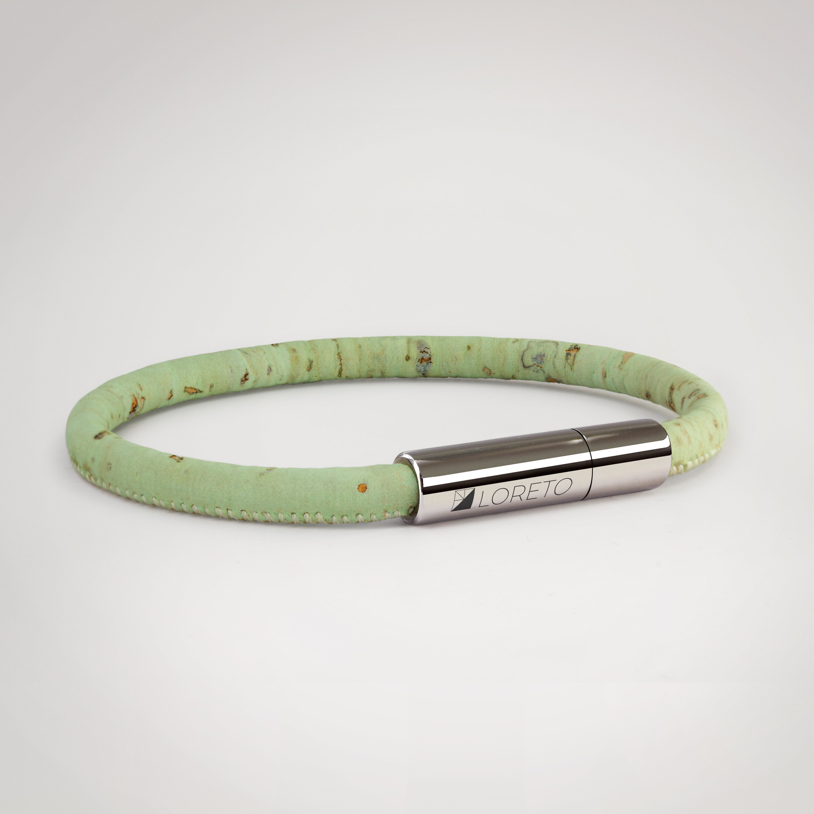 Simple green bracelet made from natural cork fiber and titanium.