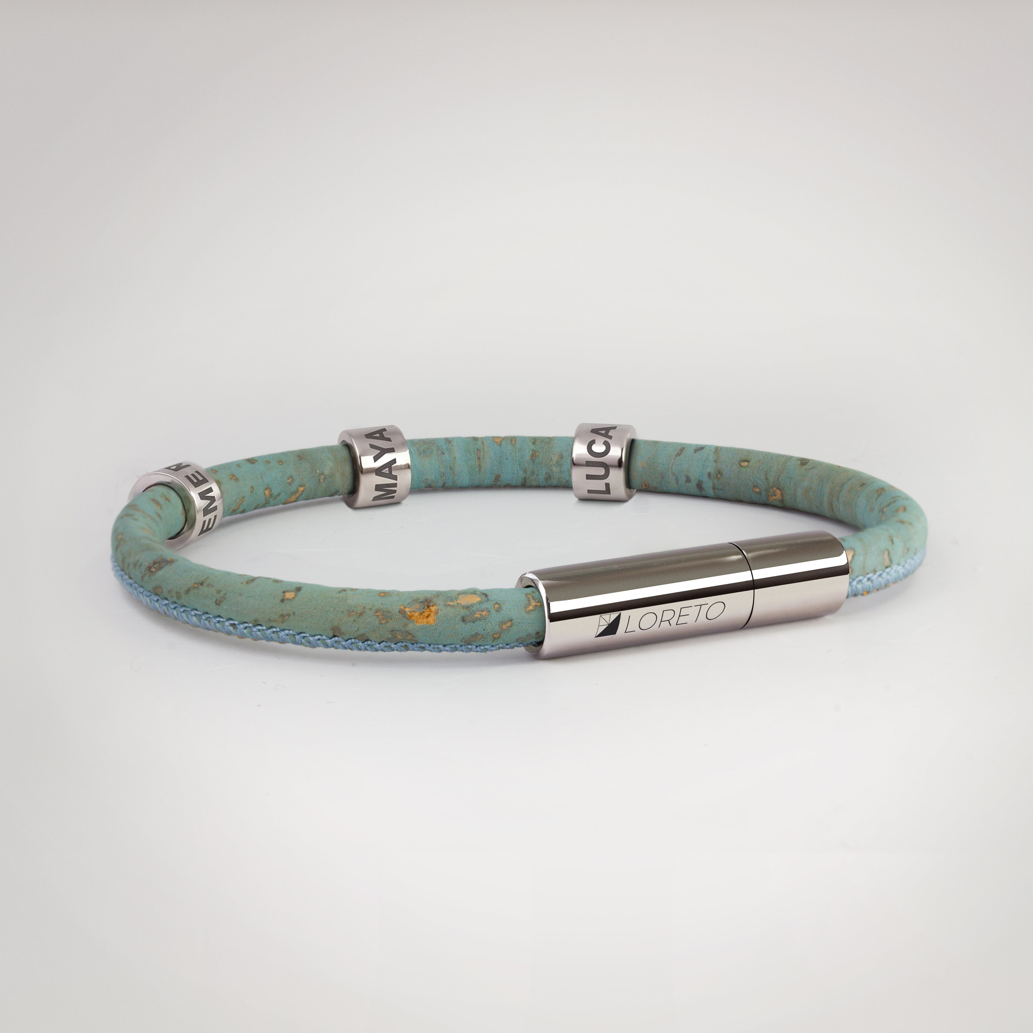 Simple blue bracelet made from natural cork fiber and titanium.