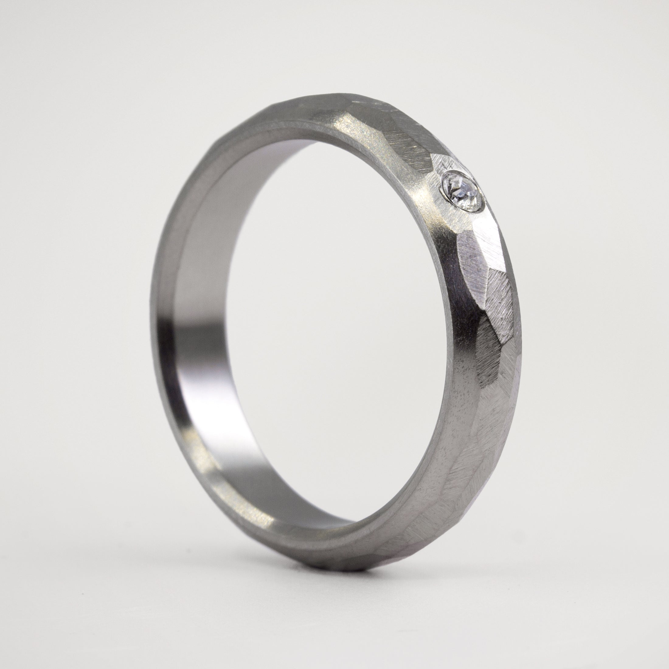 Hammered titanium with crystal ring