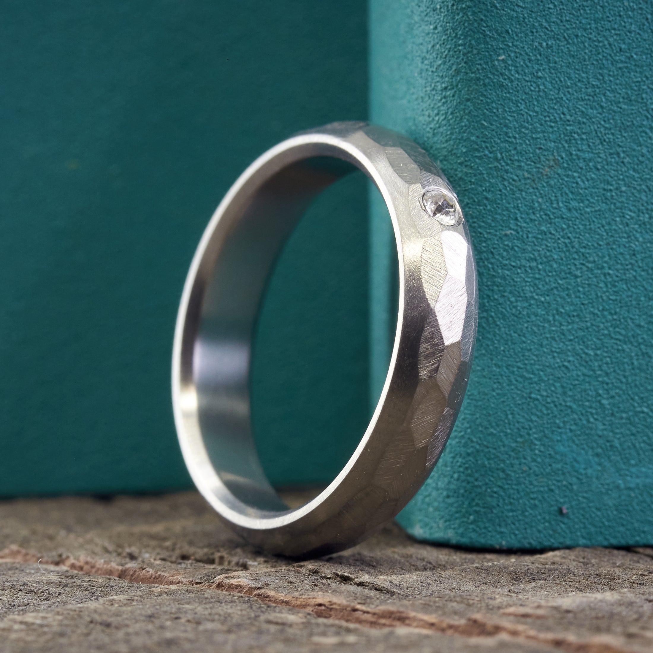 Hammered titanium with crystal ring