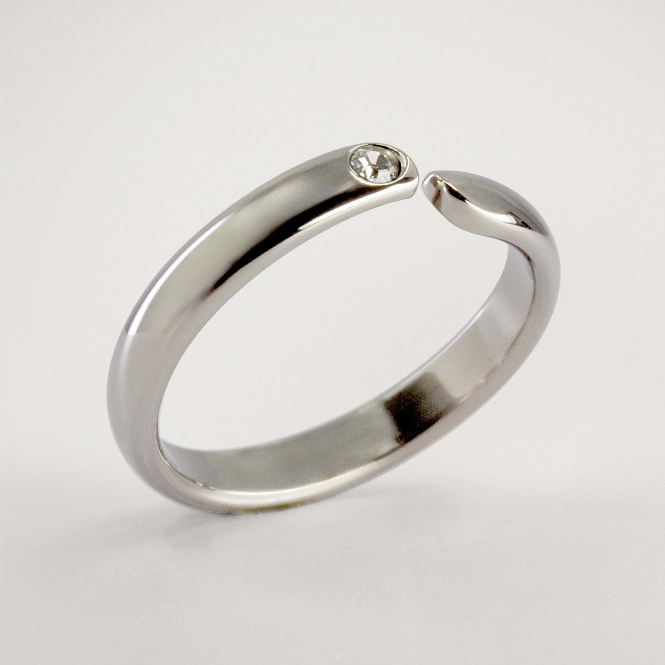 Split titanium dome ring with white crystal