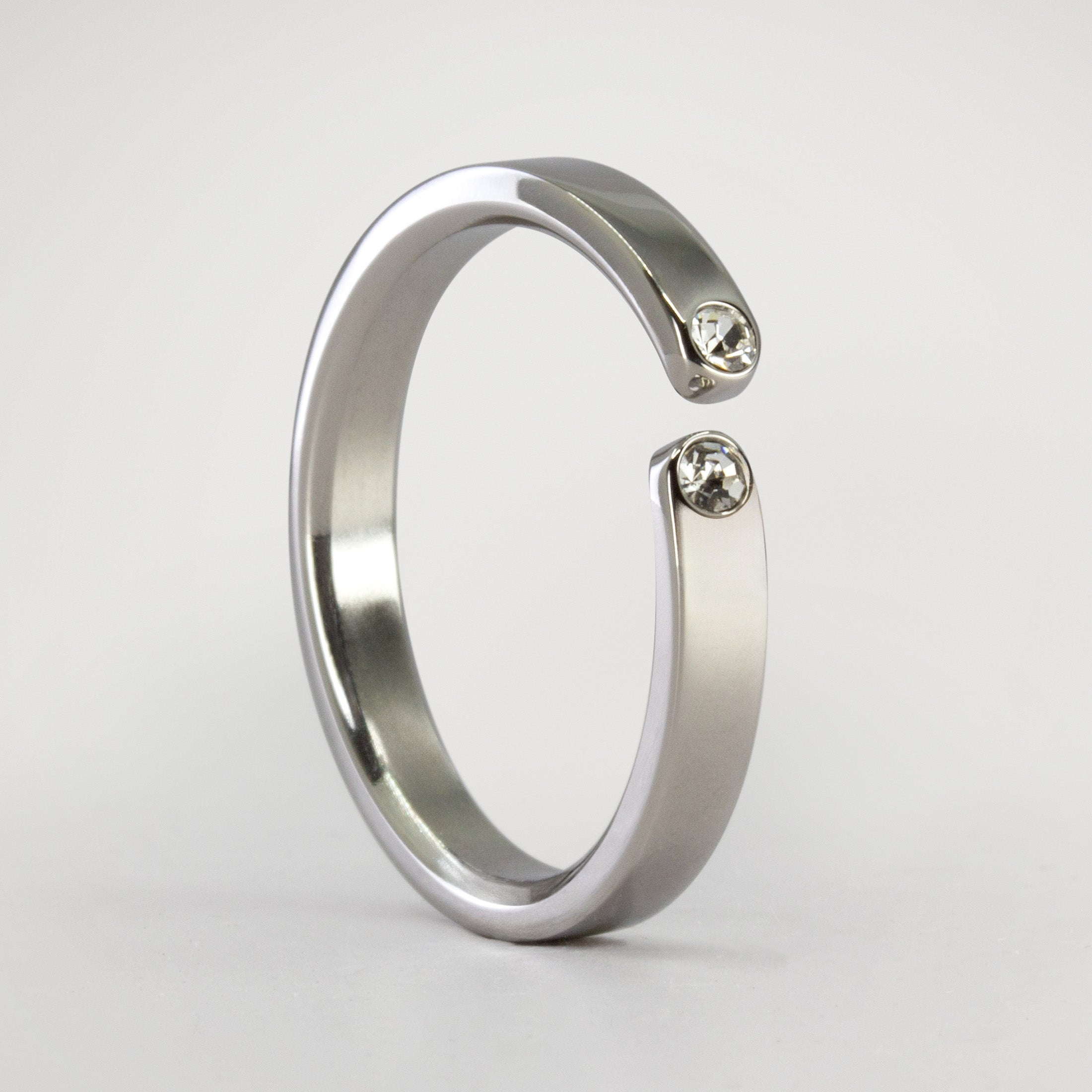 Split titanium ring with 2 white crystals