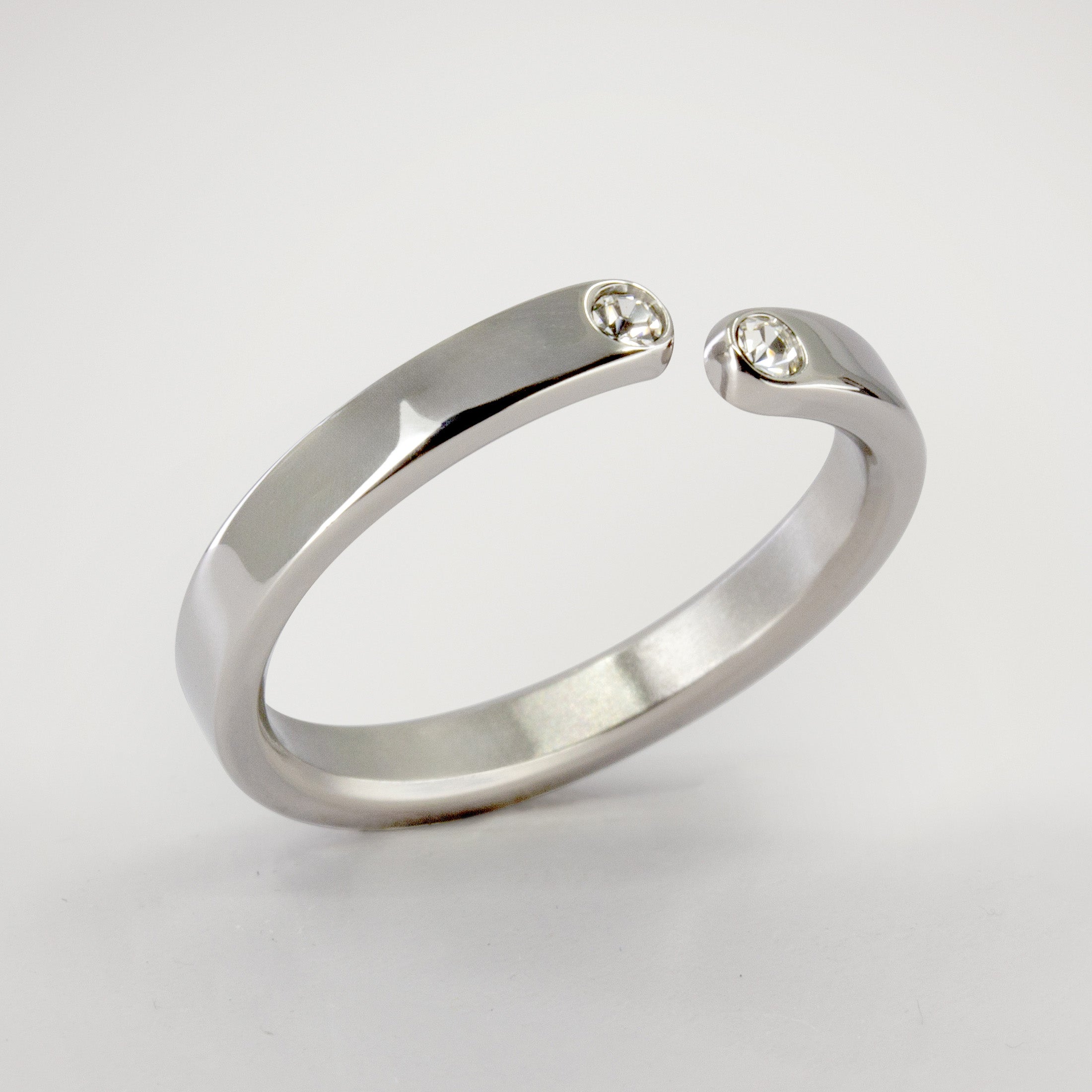 Split titanium ring with 2 white crystals