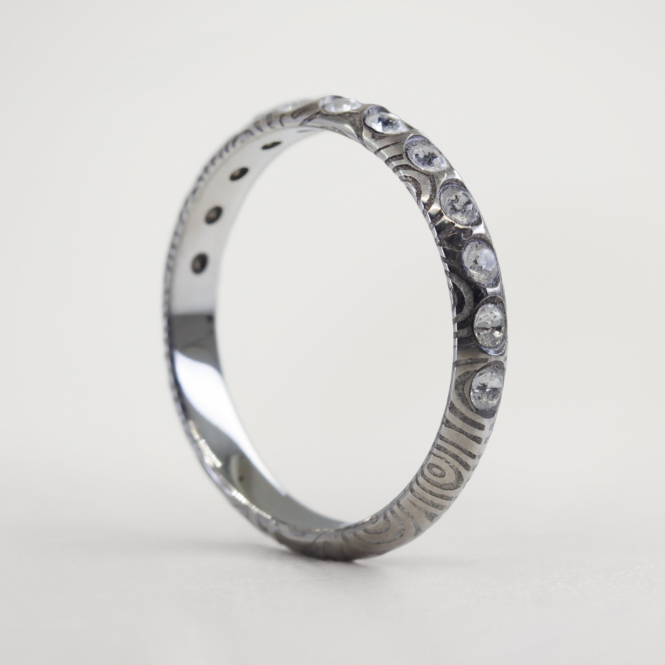 Half Eternity damascus steel ring