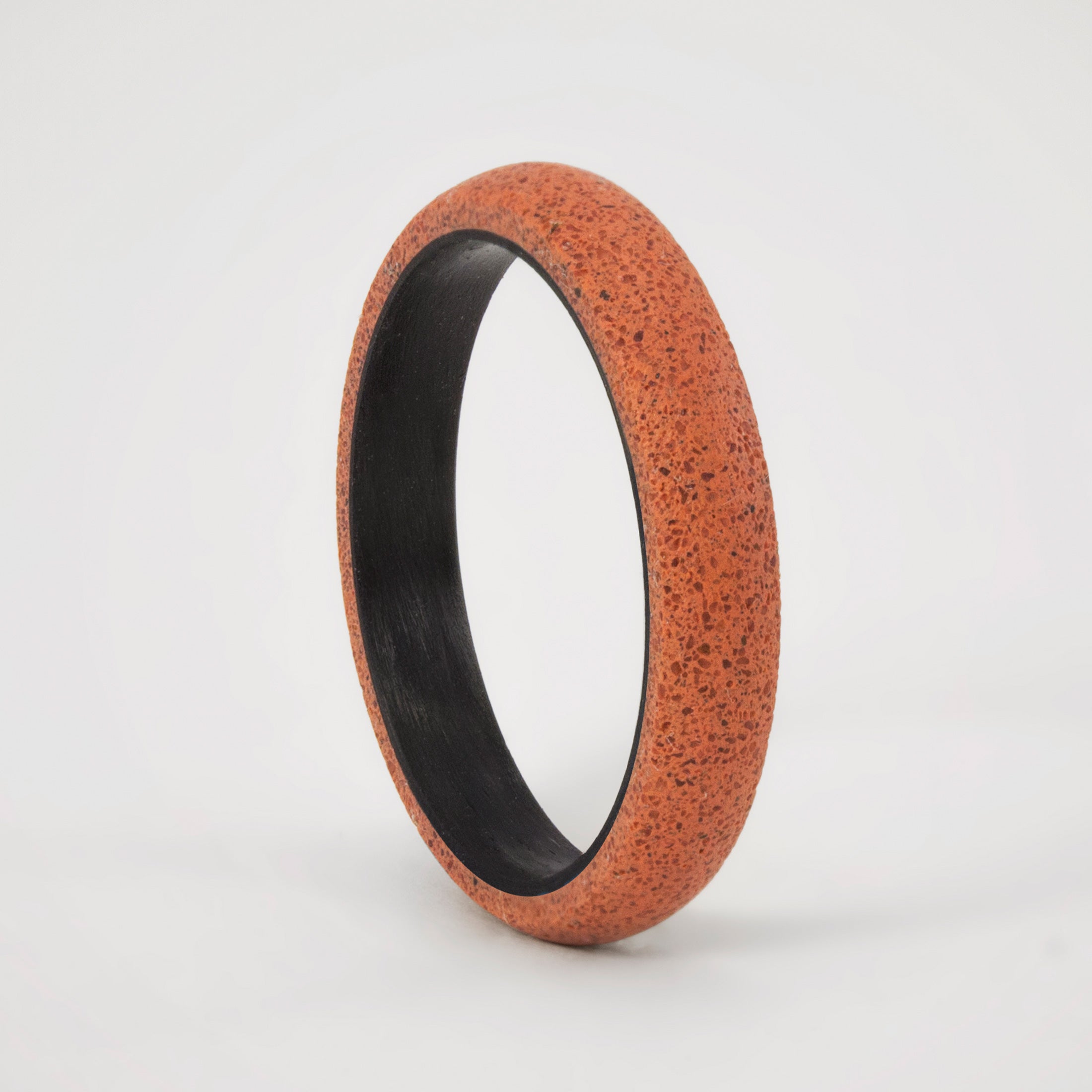 pink concrete and carbon fiber ring