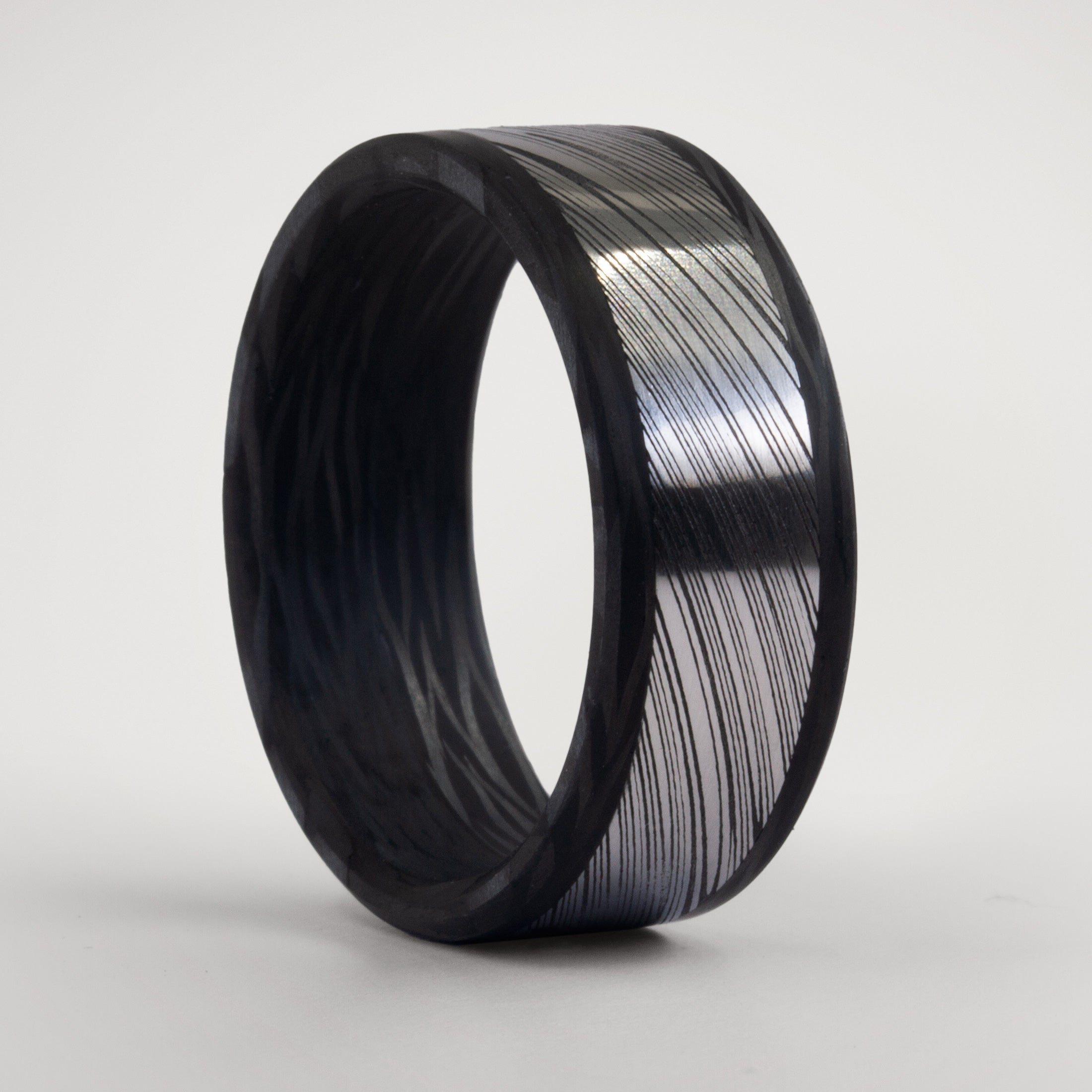 Darkened Damascus steel & wavy carbon fiber men ring