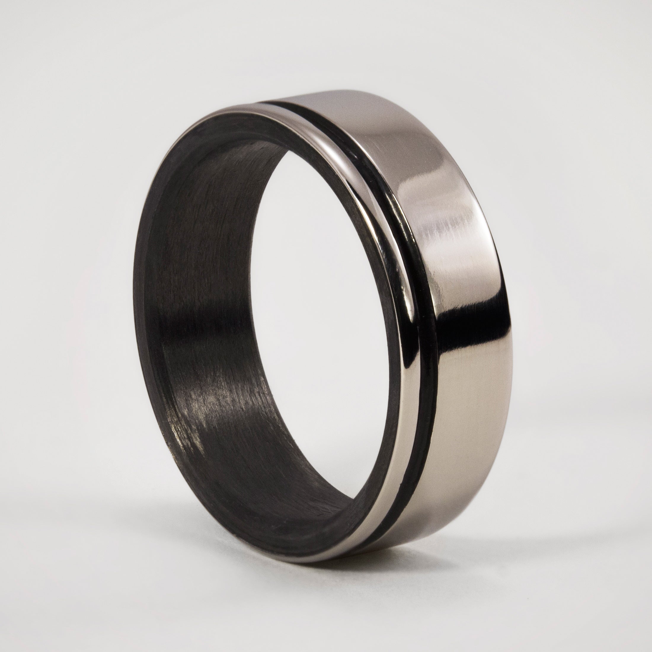 Polished titanium and carbon fiber men ring