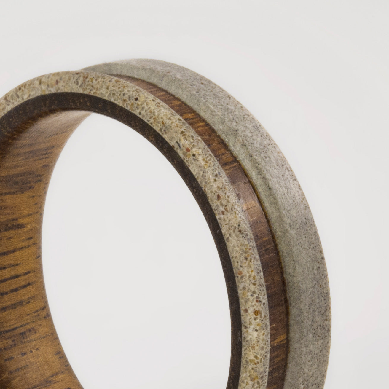 light gray concrete and wood ring