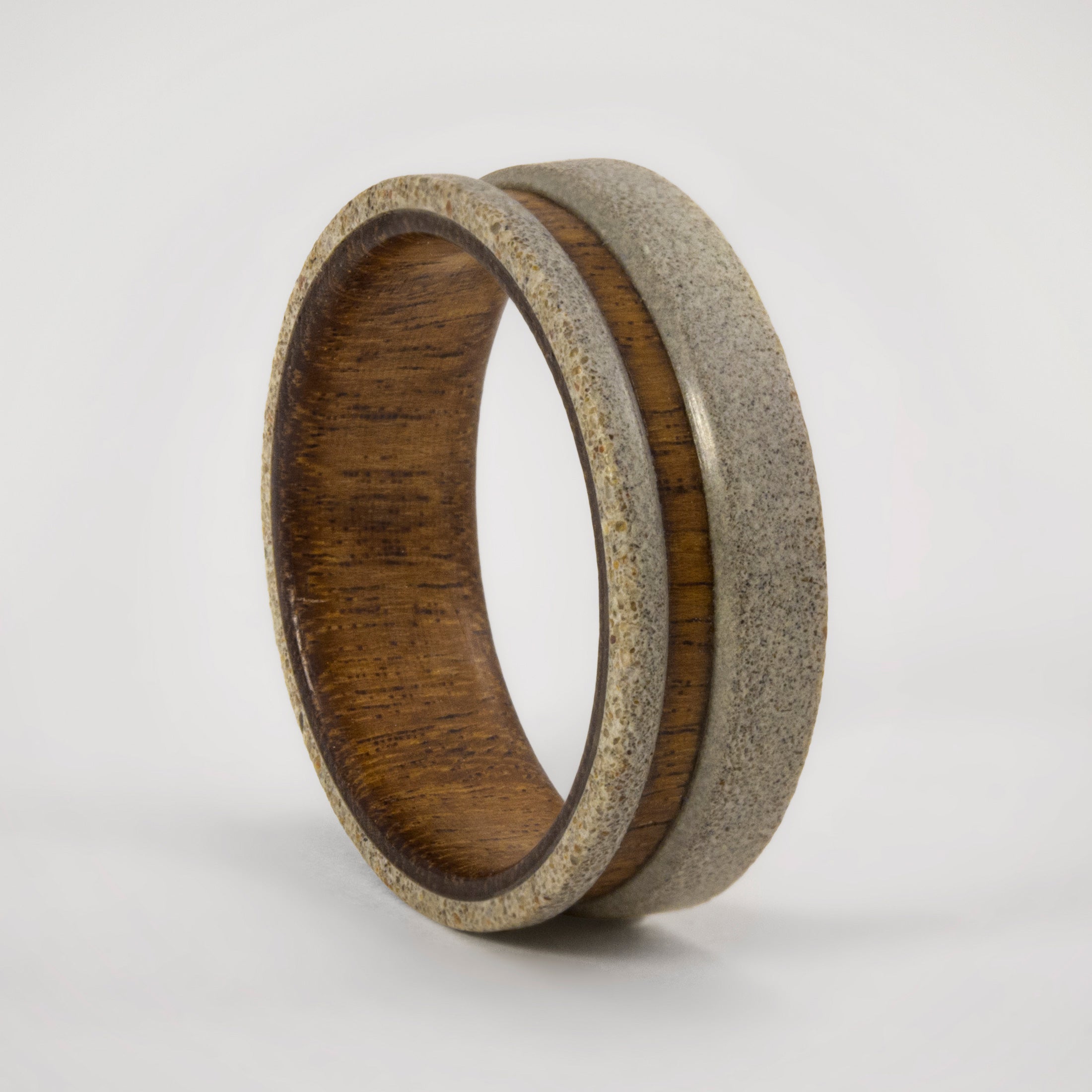 light gray concrete and wood ring
