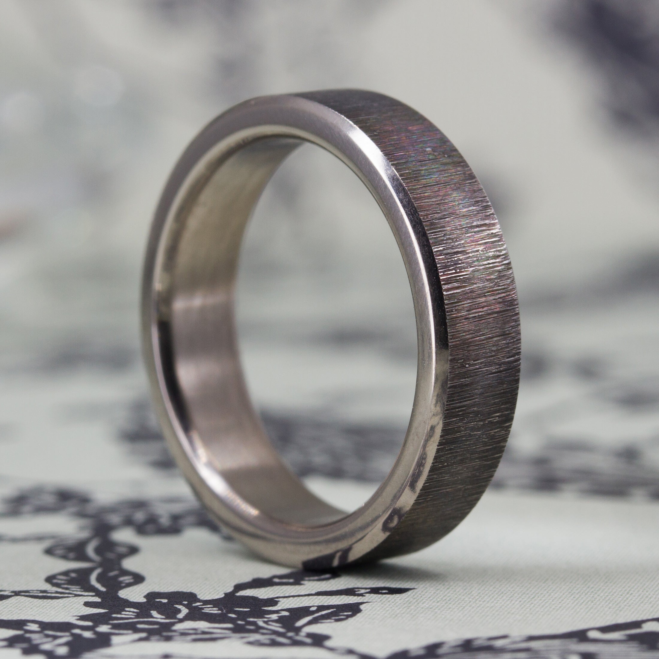 Darkened titanium ring