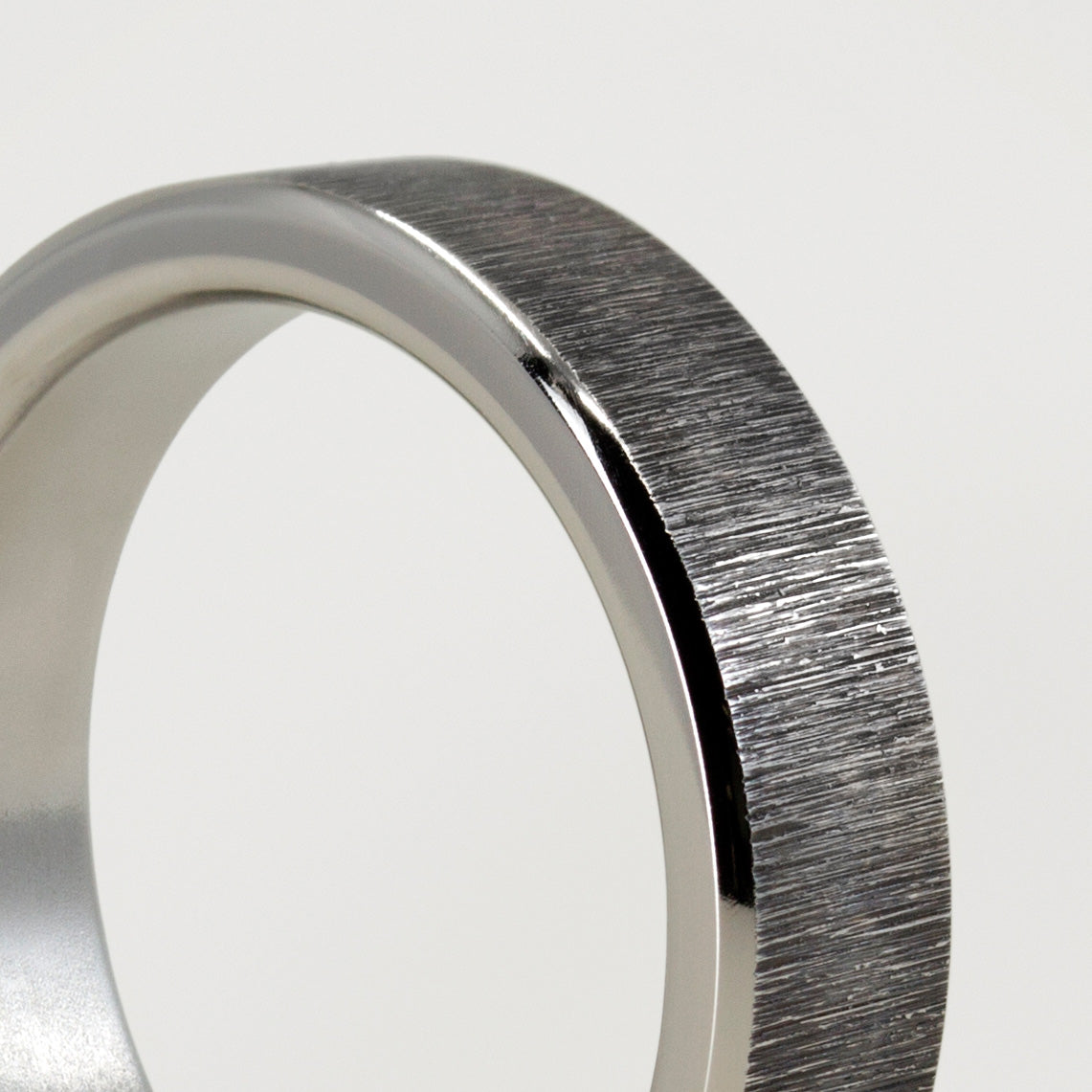 Darkened titanium ring
