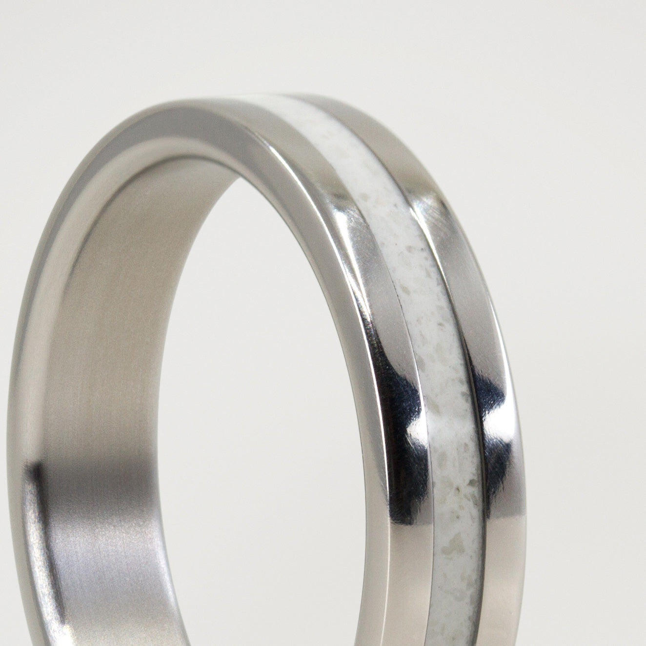 Carrara marble and polished titanium Ring