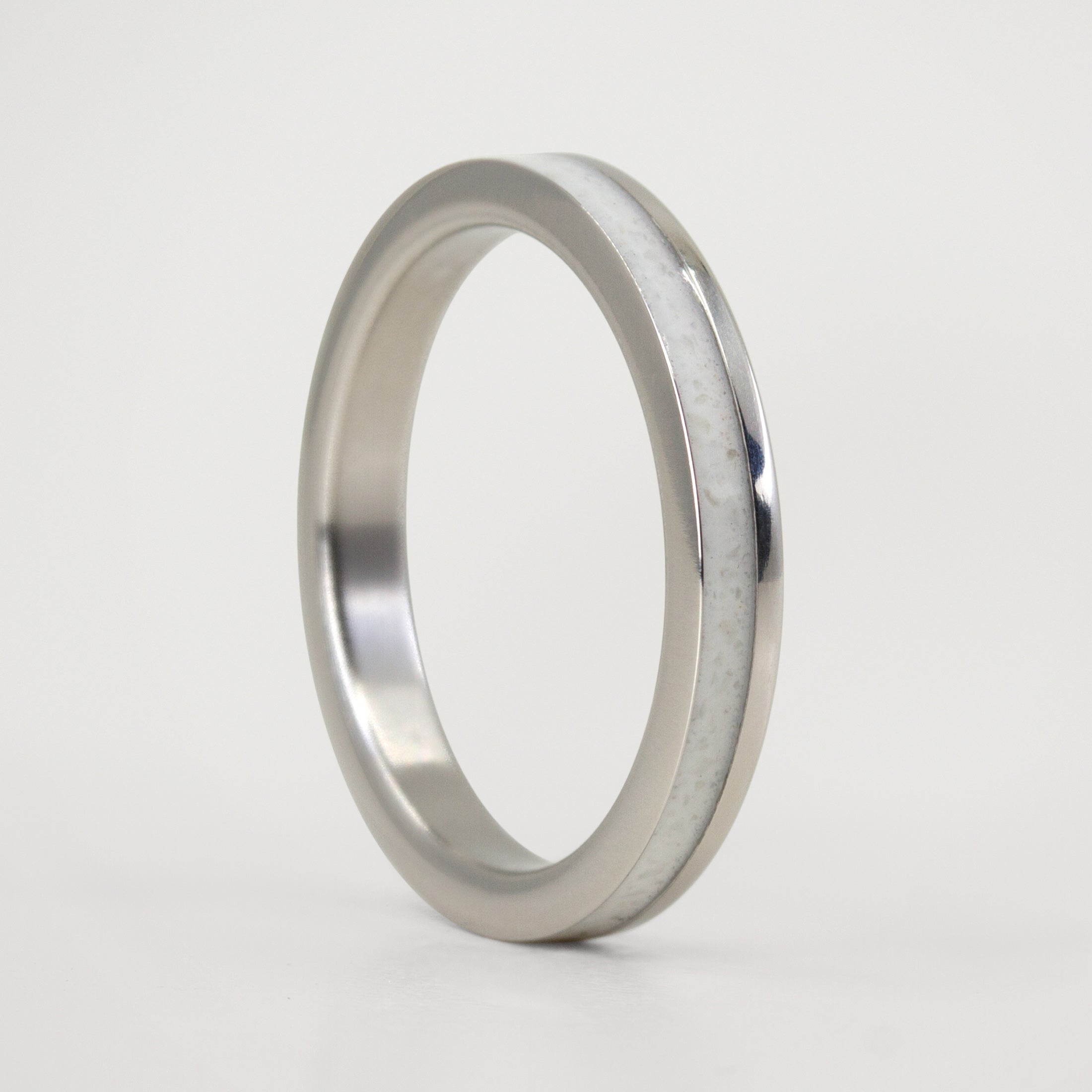Carrara marble and offset polished titanium Ring