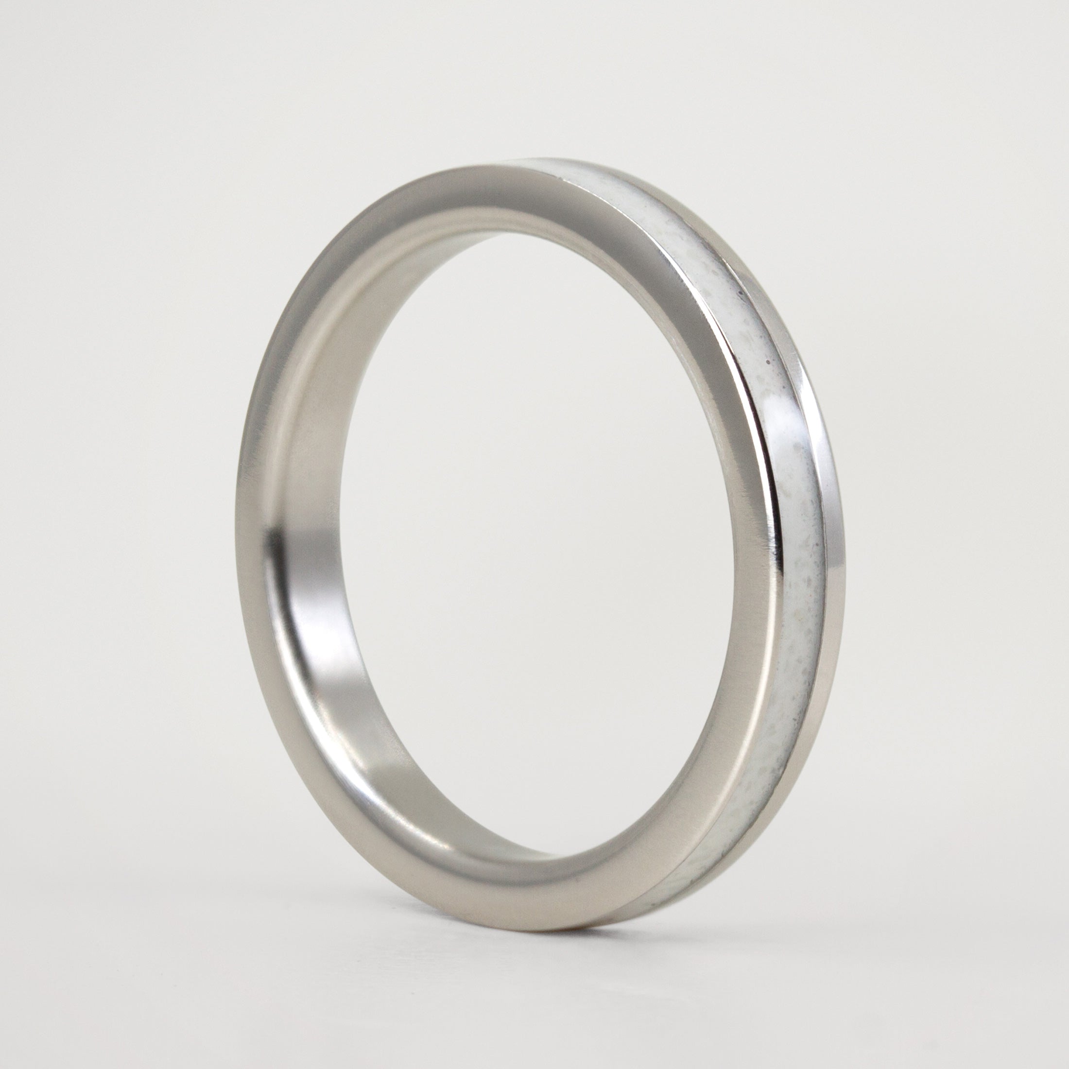 Carrara marble and offset polished titanium Ring
