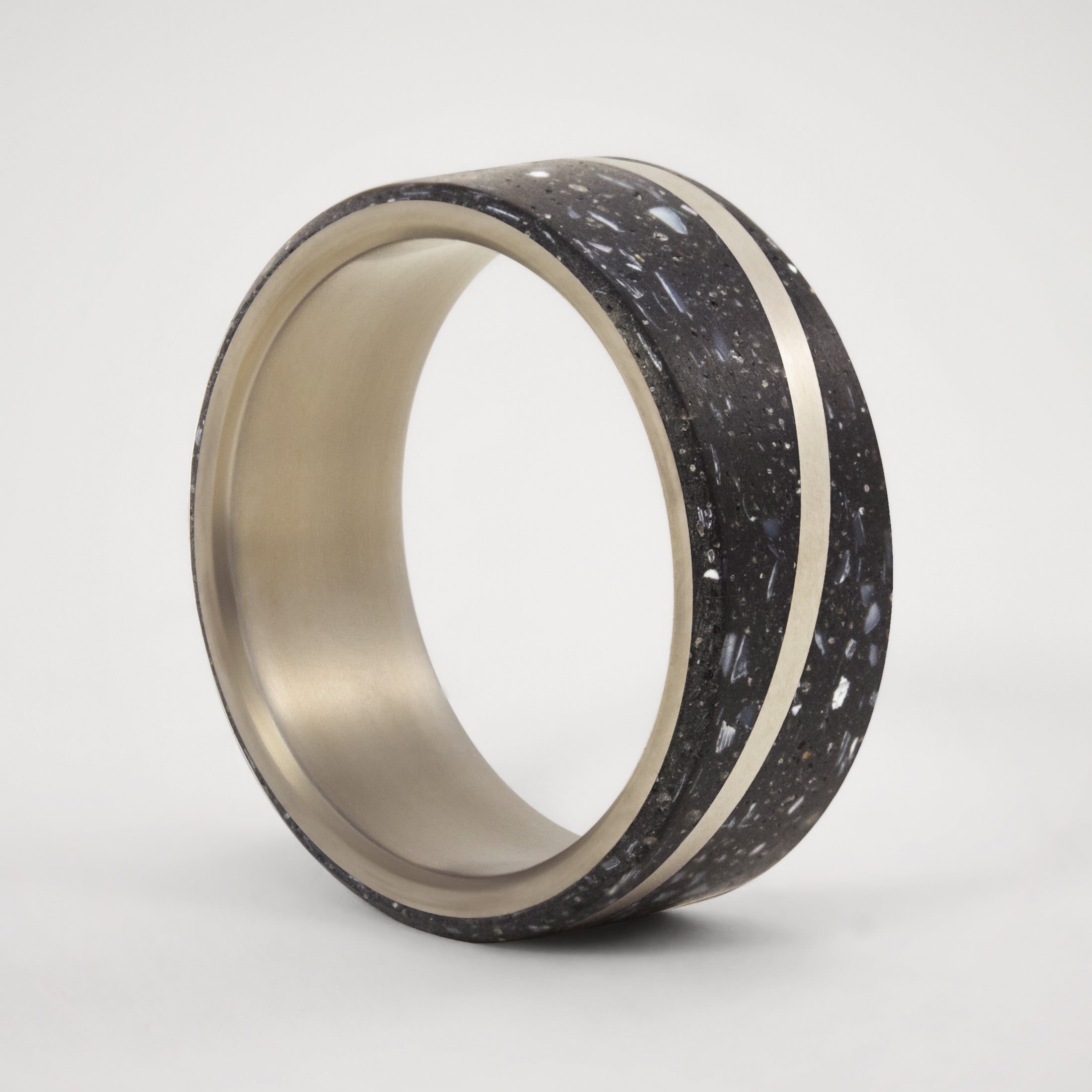 Black concrete with nacre sparkles and titanium Ring
