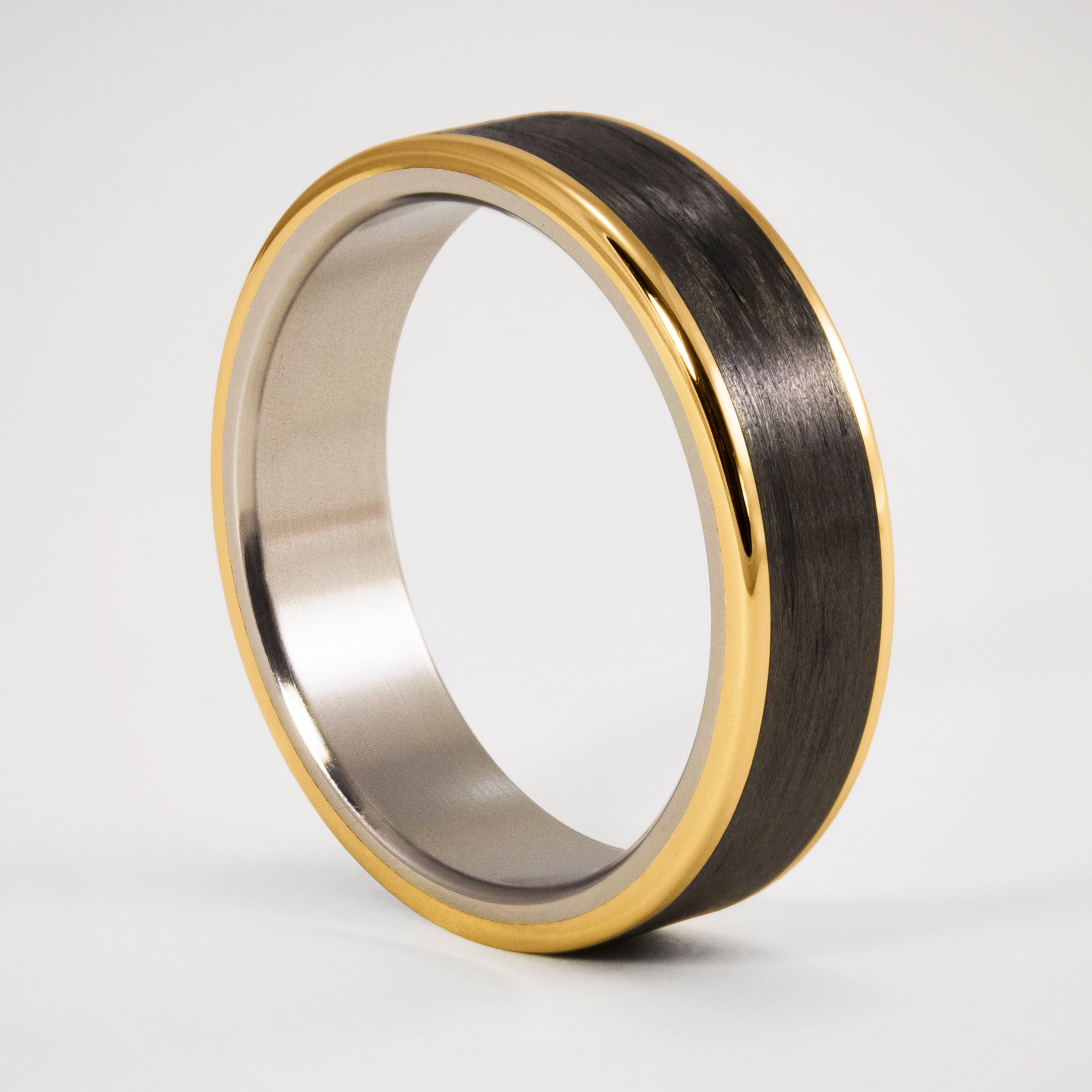 18K Gold, carbon fiber and titanium Ring